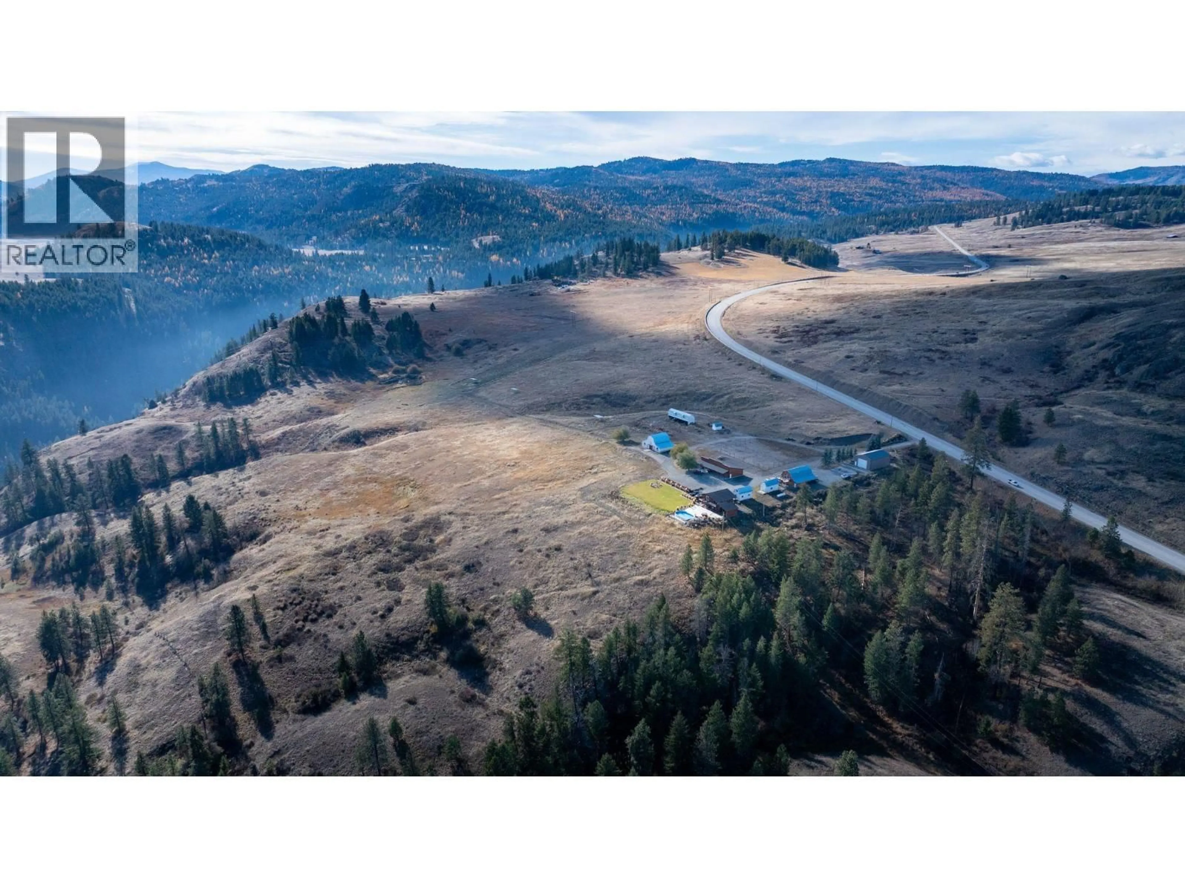 A pic from outside/outdoor area/front of a property/back of a property/a pic from drone, mountain view for 4520 HIGHWAY 3 OTHER, Rock Creek British Columbia V0H1Y0