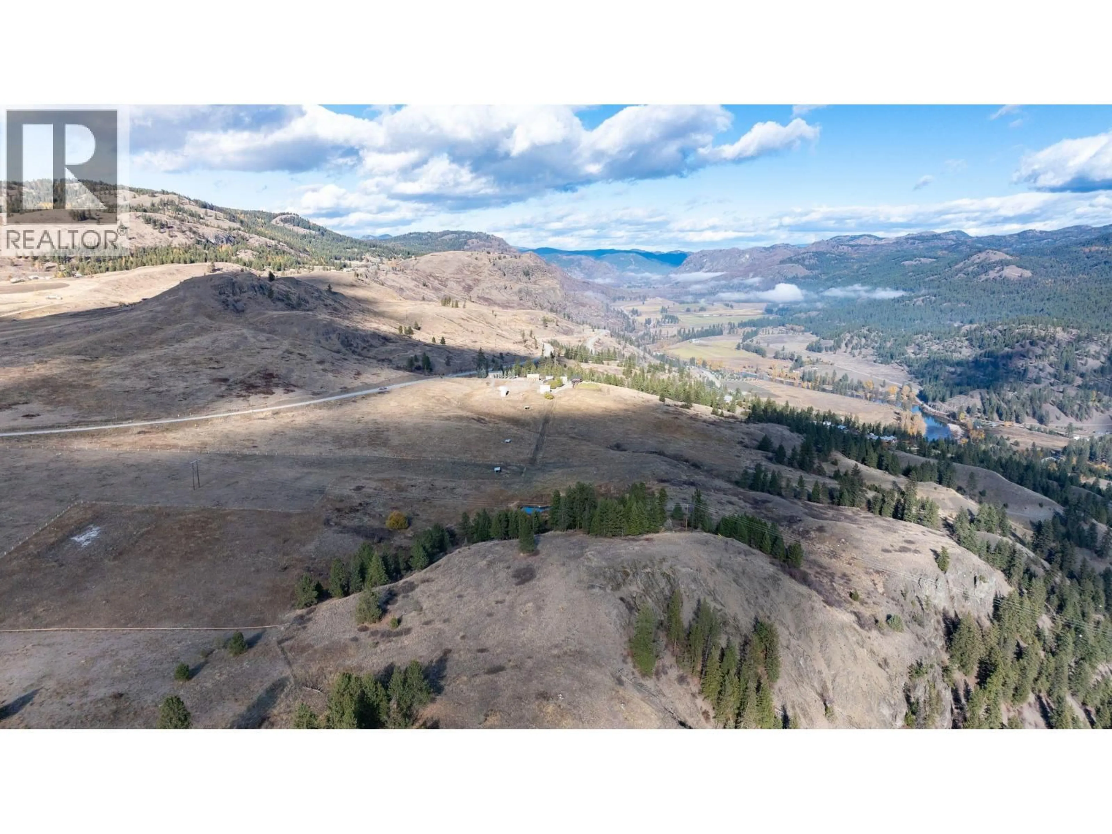 A pic from outside/outdoor area/front of a property/back of a property/a pic from drone, mountain view for 4520 HIGHWAY 3 OTHER, Rock Creek British Columbia V0H1Y0