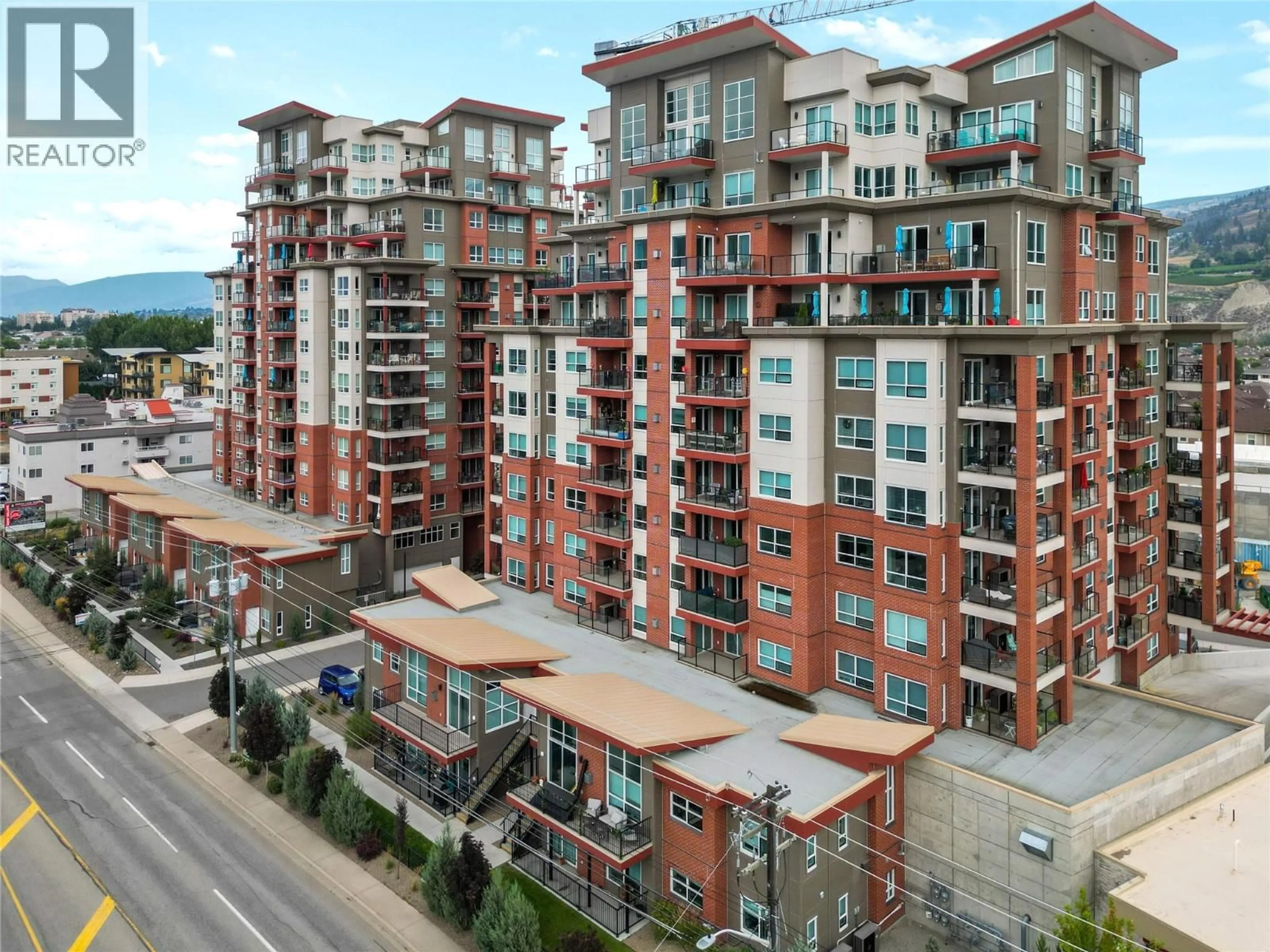 A pic from outside/outdoor area/front of a property/back of a property/a pic from drone, city buildings view from balcony for 1004 - 3388 SKAHA LAKE ROAD, Penticton British Columbia V2A6G4