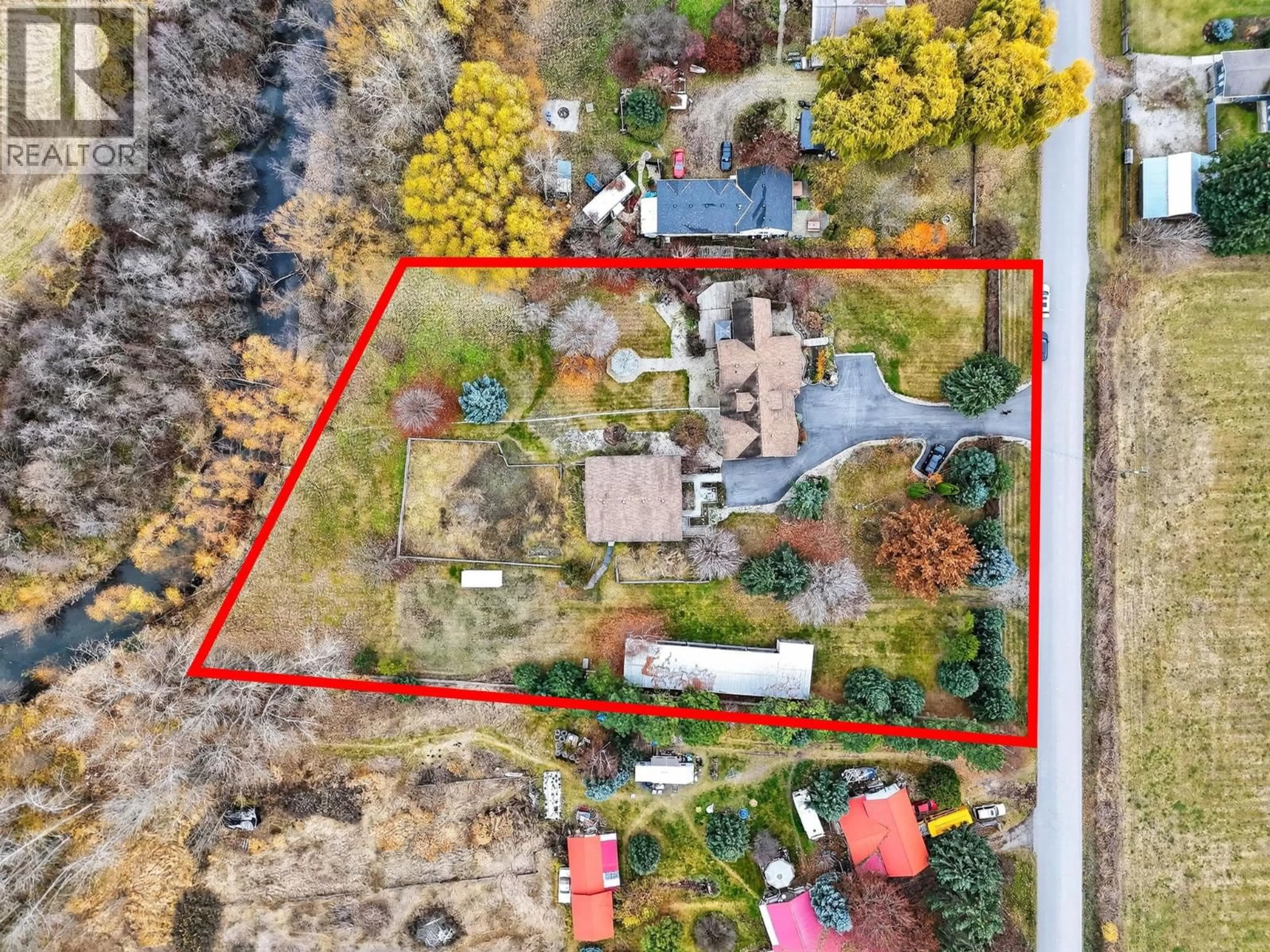 A pic from outside/outdoor area/front of a property/back of a property/a pic from drone, street for 3194 JOHNSON ROAD, Salmon Arm British Columbia V1E3E6