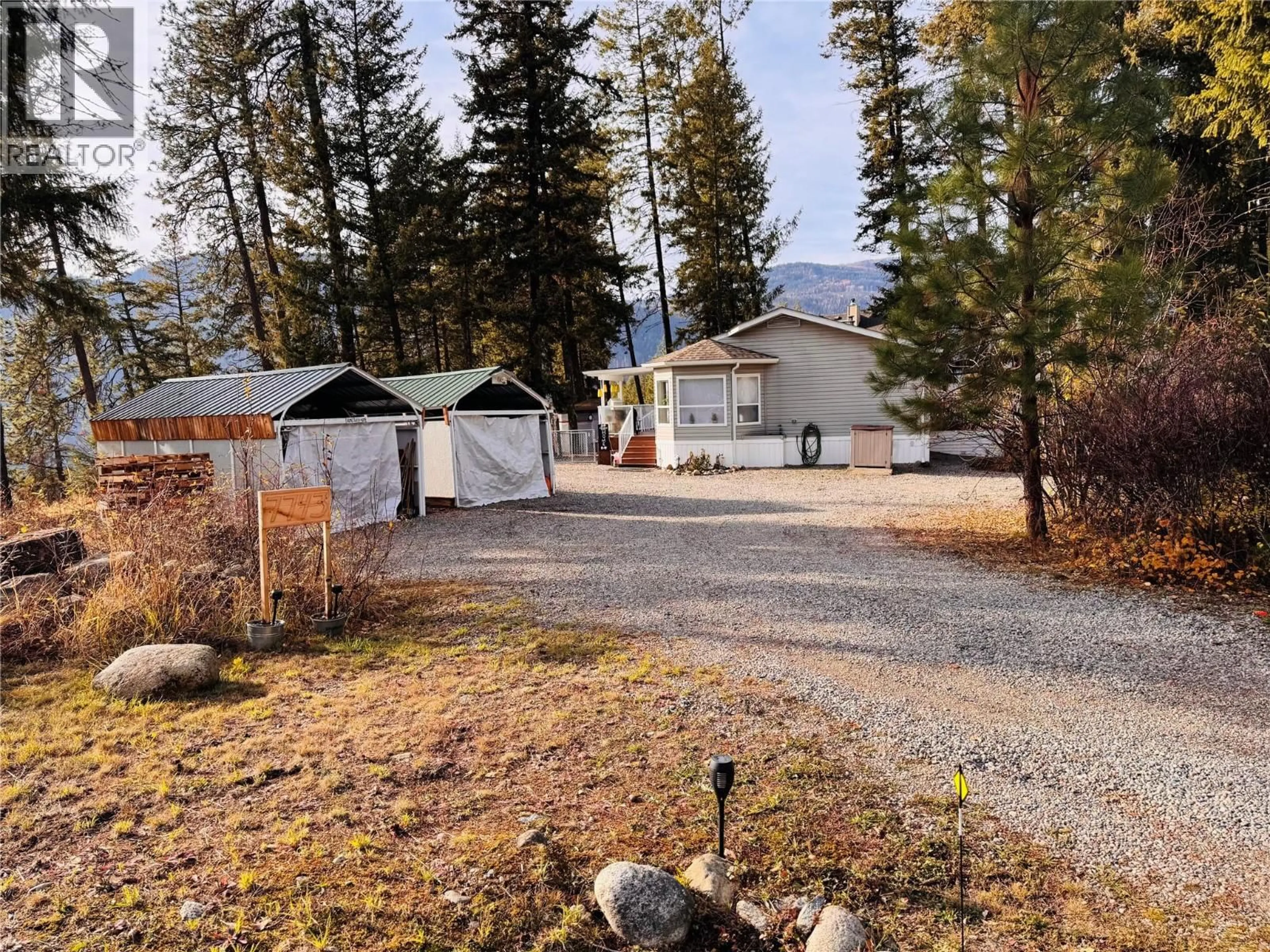 A pic from outside/outdoor area/front of a property/back of a property/a pic from drone, unknown for 7743 MCRAE ROAD, Christina Lake British Columbia V0H1E0