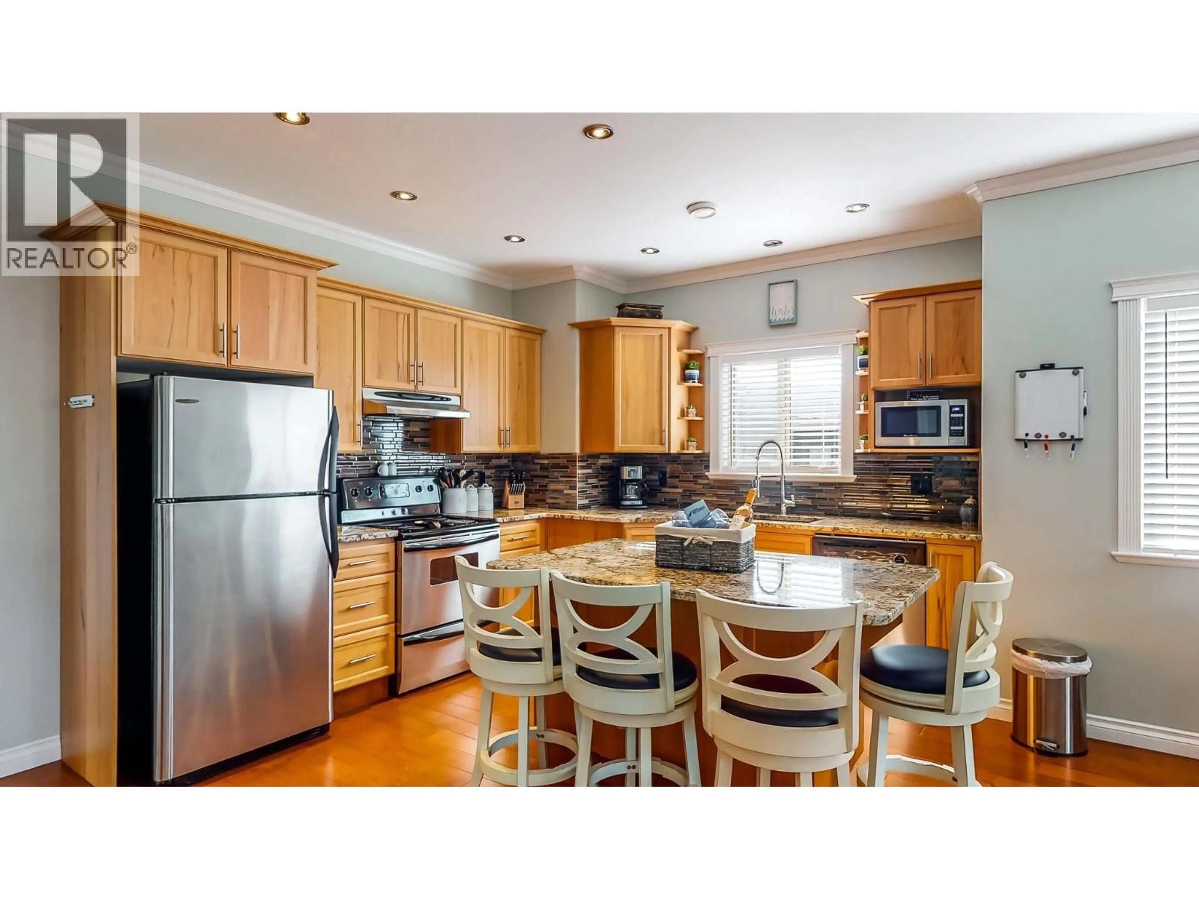 Open concept kitchen, wood/laminate floor for 202 - 144 POWER STREET, Penticton British Columbia V2A5W9