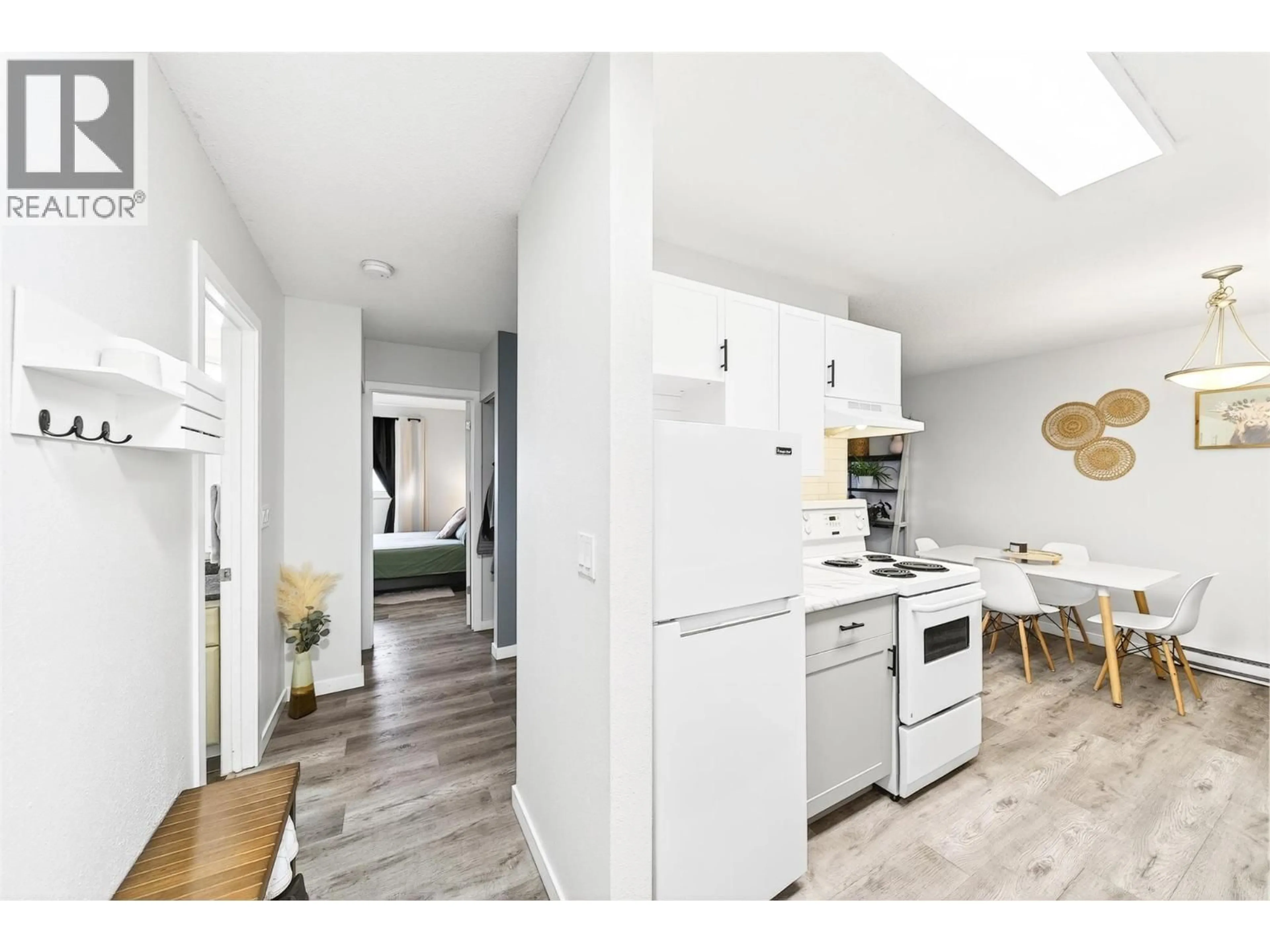 Open concept kitchen, wood/laminate floor for 209 - 555 DALGLEISH DRIVE, Kamloops British Columbia V2C6C7