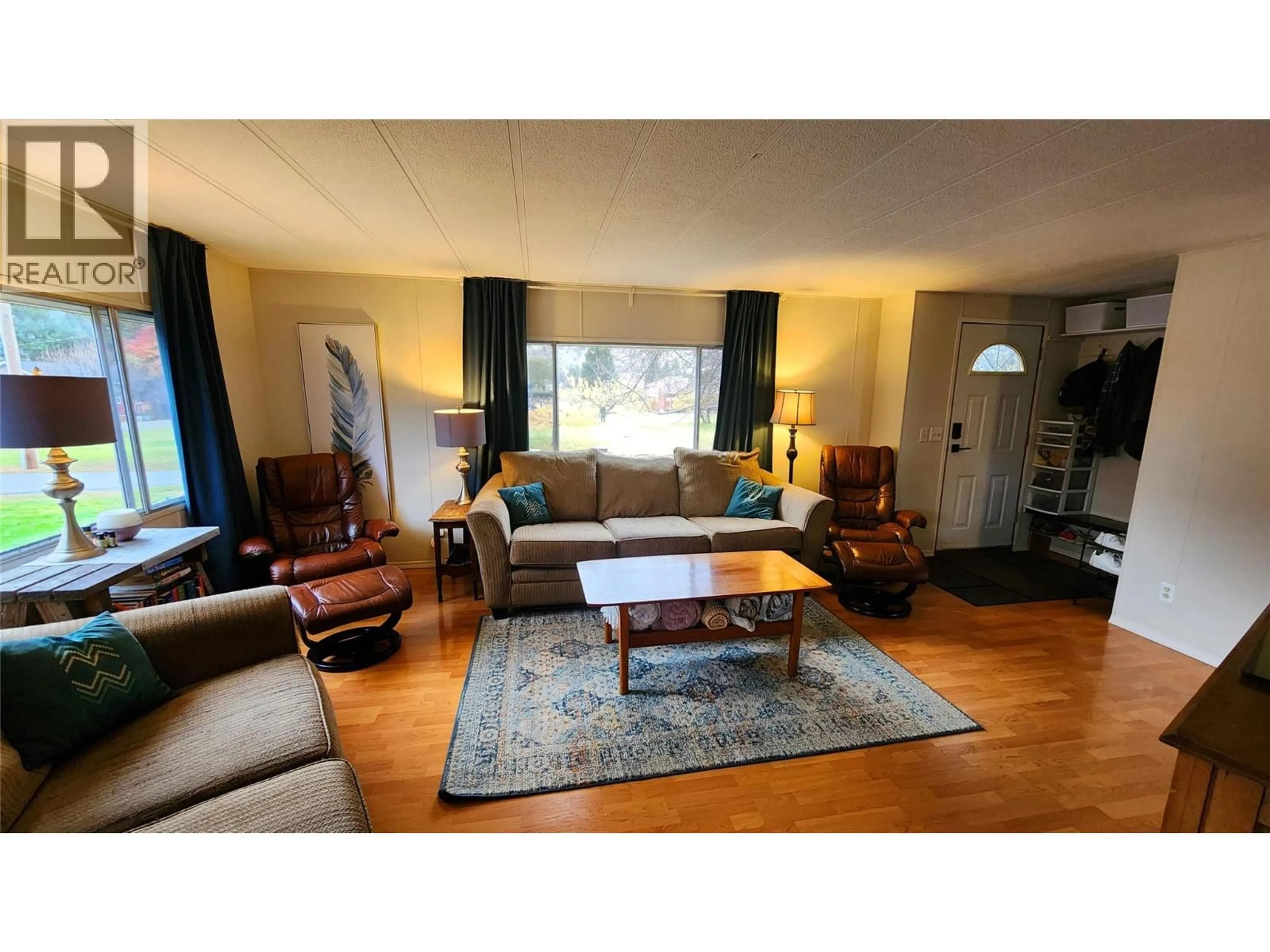 Living room with furniture, wood/laminate floor for 224 9TH AVENUE, Keremeos British Columbia V0X1N3