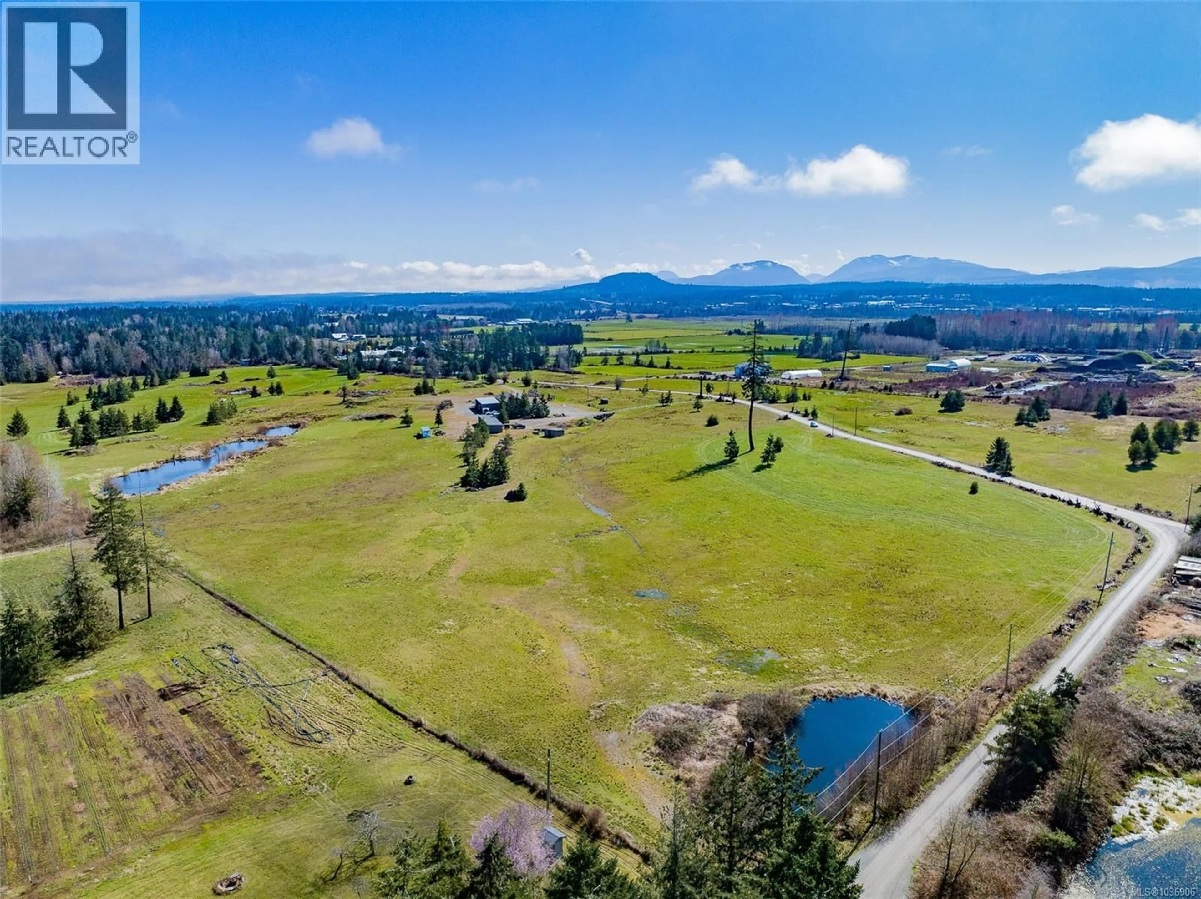 A pic from outside/outdoor area/front of a property/back of a property/a pic from drone, mountain view for 1355 HODGES ROAD, French Creek British Columbia V9P2B5