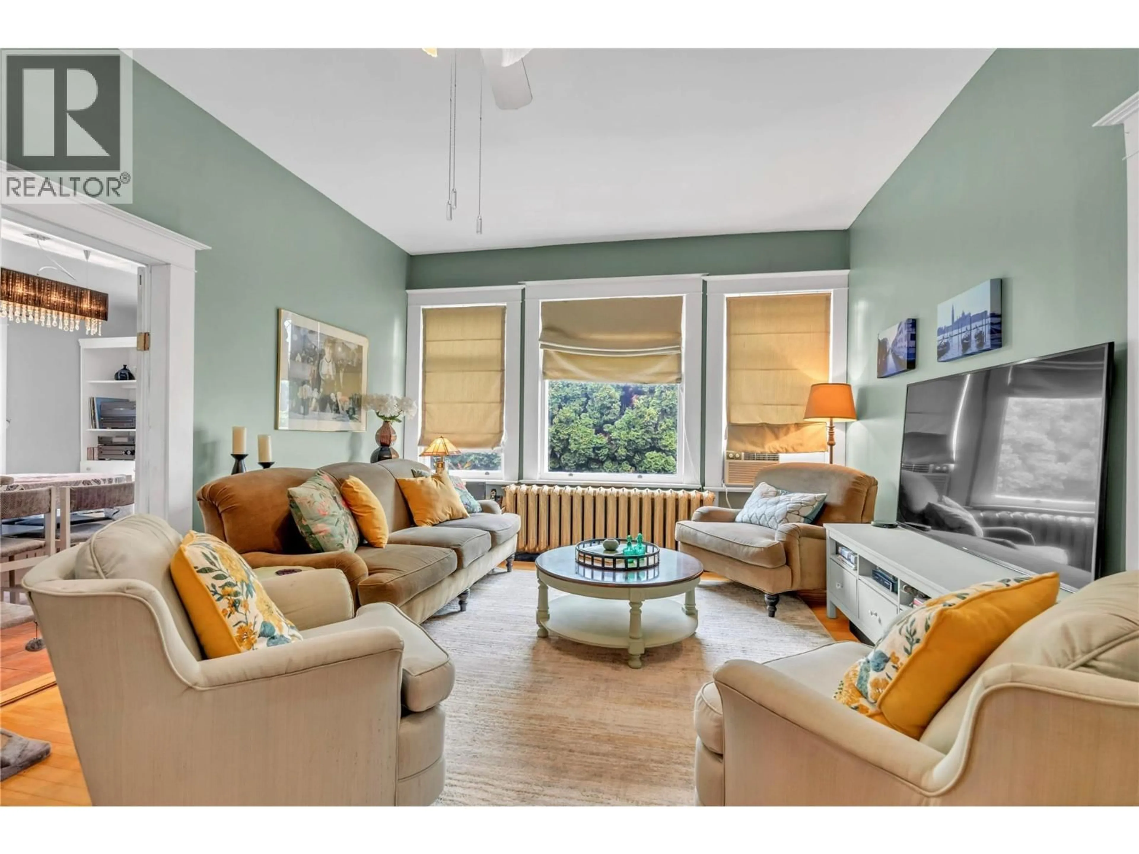 Living room with furniture, wood/laminate floor for 494 YOUNG STREET, Penticton British Columbia V2A5T1