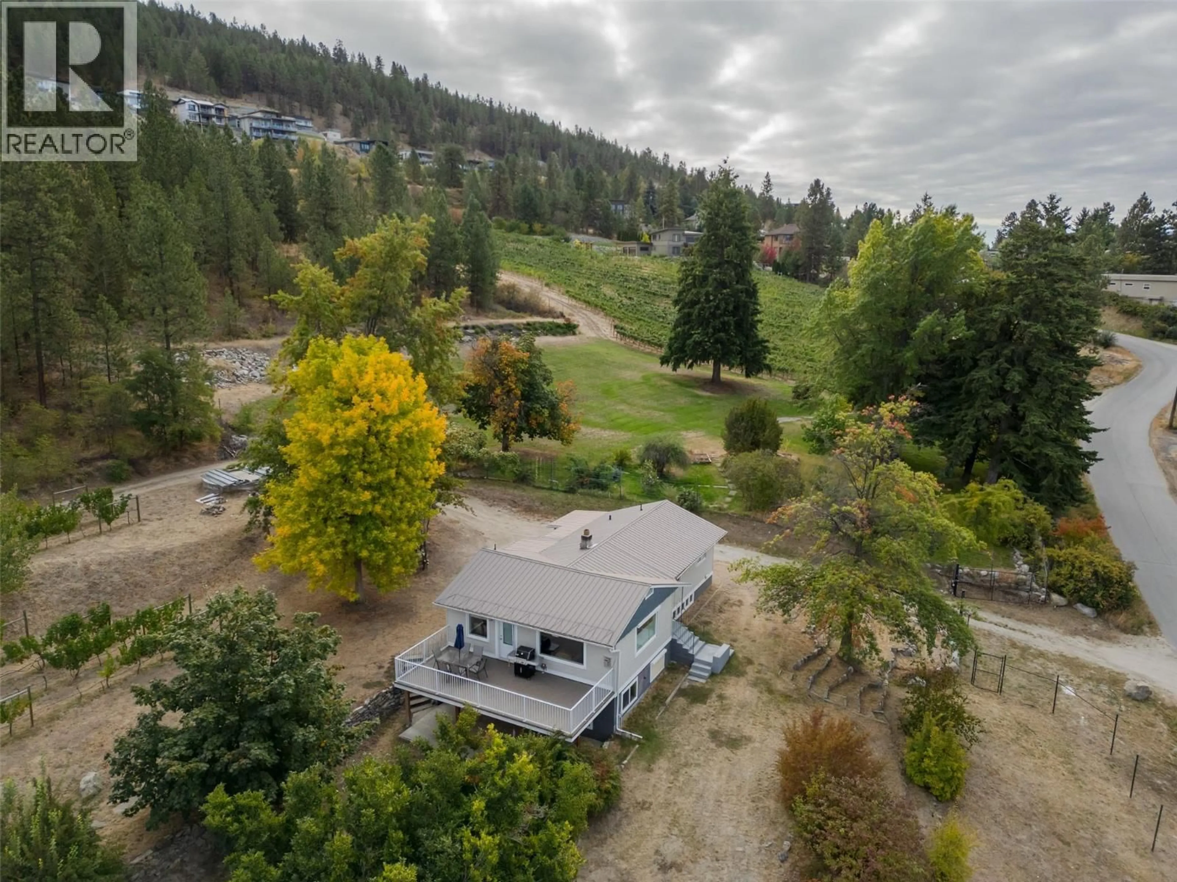 A pic from outside/outdoor area/front of a property/back of a property/a pic from drone, forest/trees view for 2864 ARAWANA ROAD, Naramata British Columbia V0H1N1