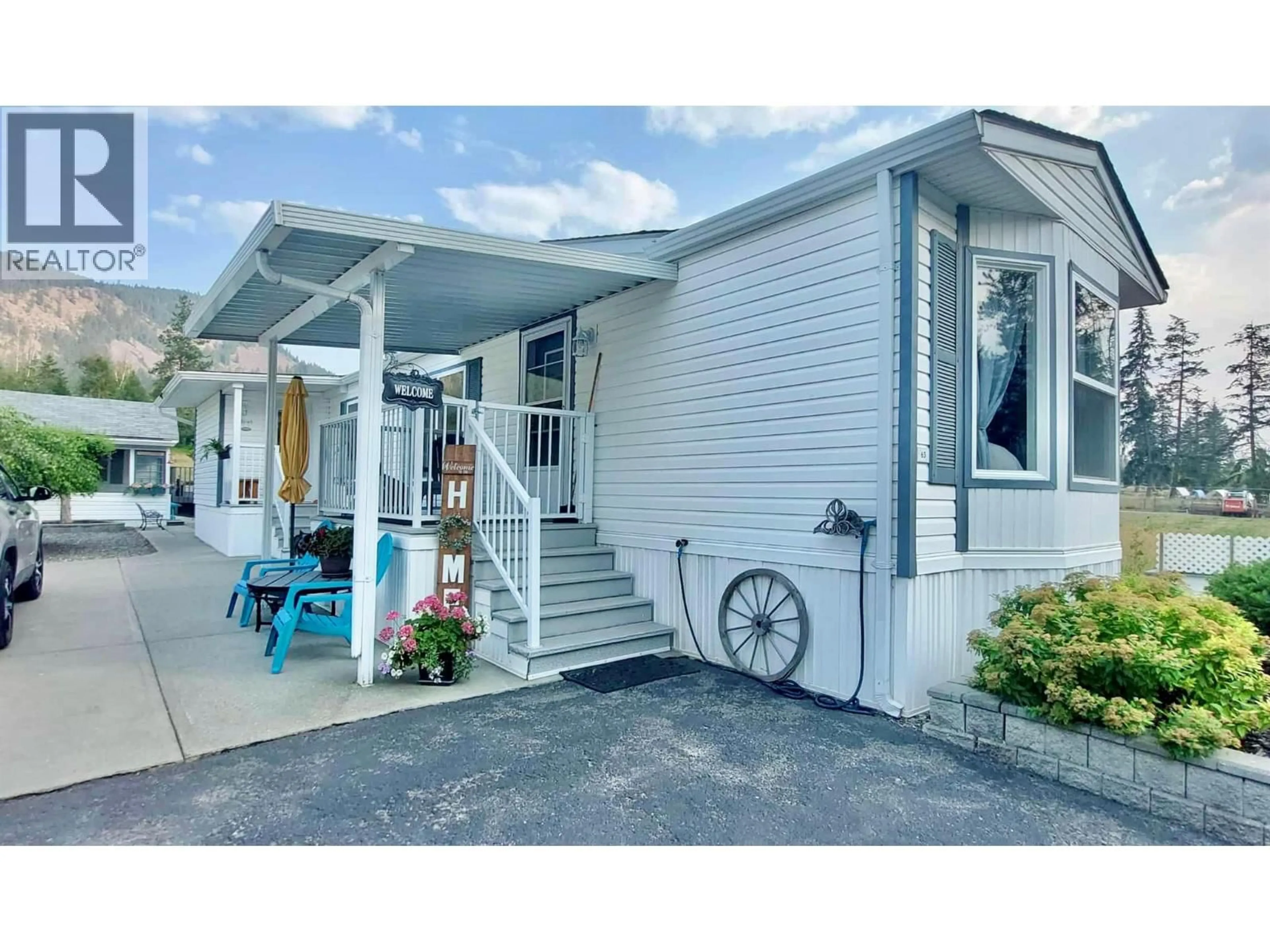 Home with vinyl exterior material, street for 4965 PINE ACRES ROAD, Chase British Columbia V0E1M3