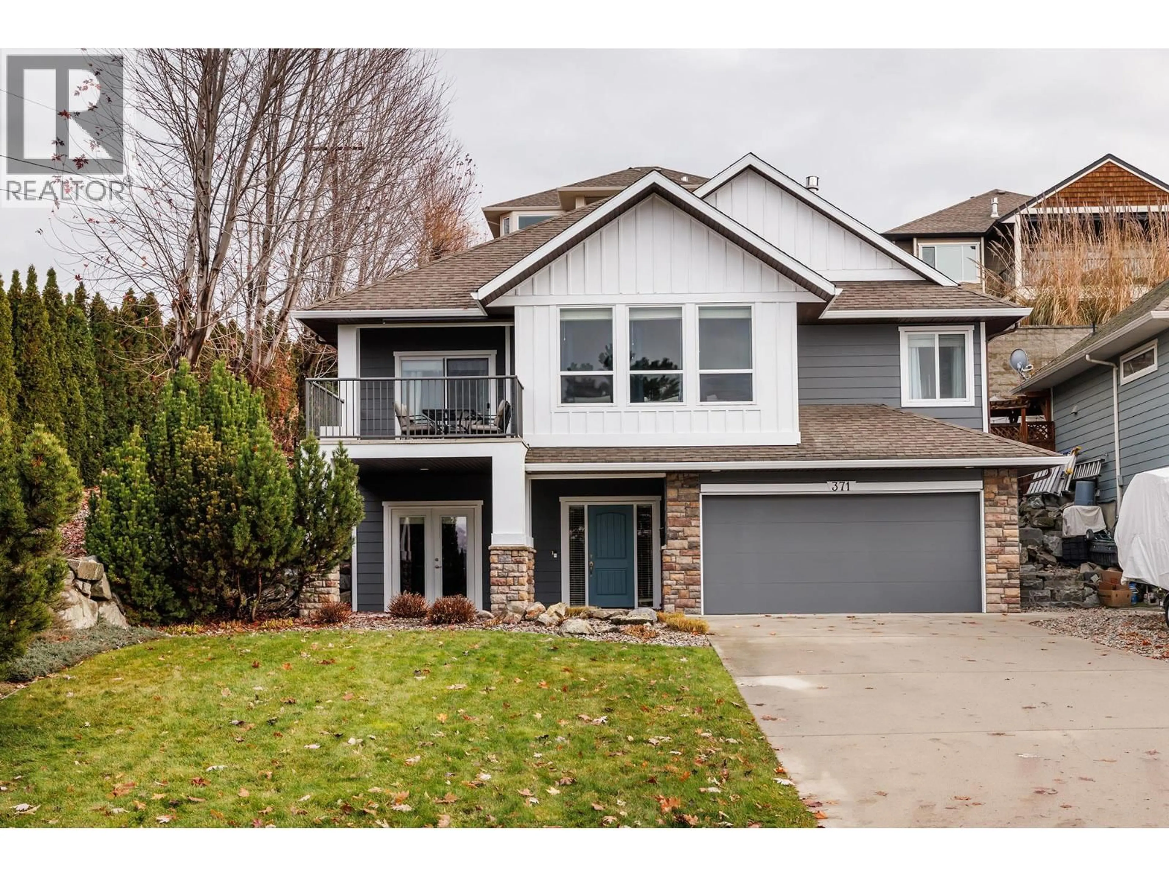 Home with vinyl exterior material, street for 371 POONIAN STREET, Kelowna British Columbia V1X8C3