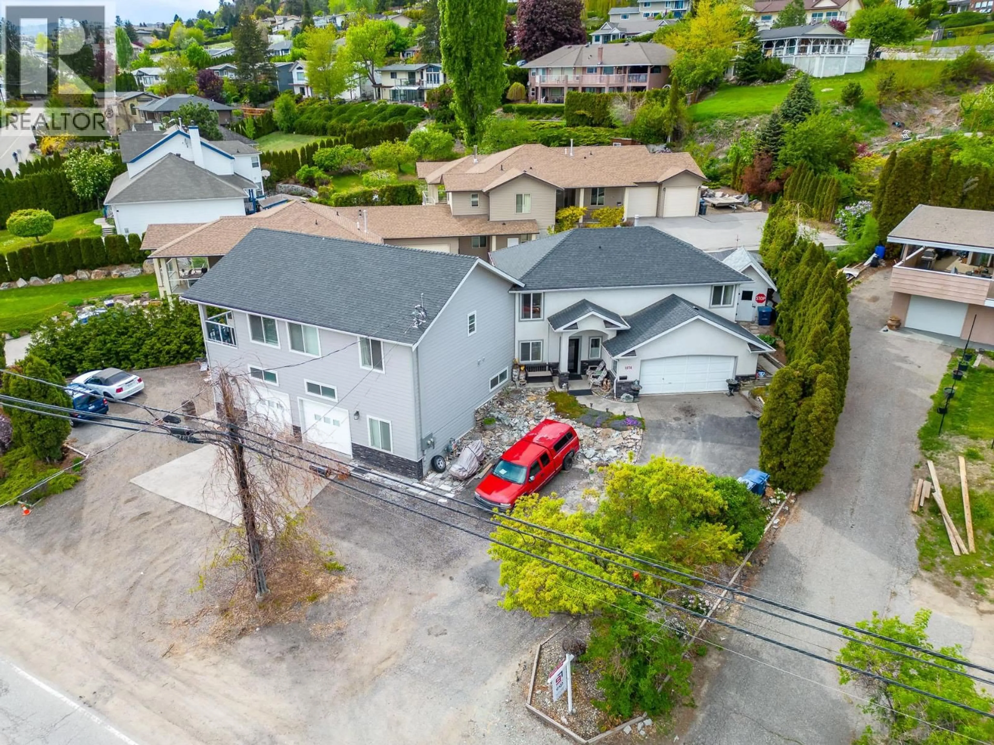 A pic from outside/outdoor area/front of a property/back of a property/a pic from drone, street for 3174 BOUCHERIE ROAD, West Kelowna British Columbia V1Z2G9
