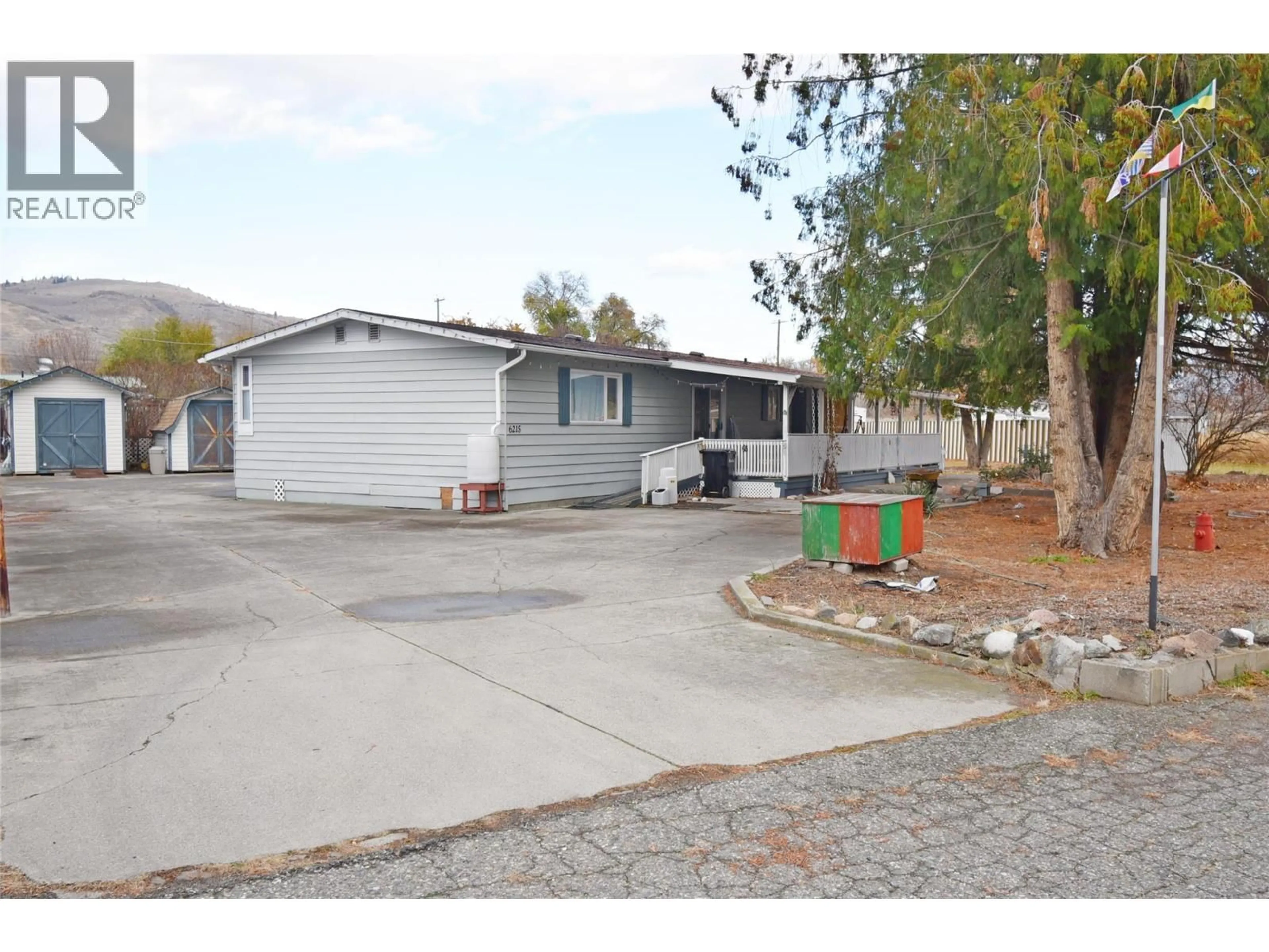 Home with vinyl exterior material, street for 6215 QUAIL ROAD, Vernon British Columbia V1H1M8