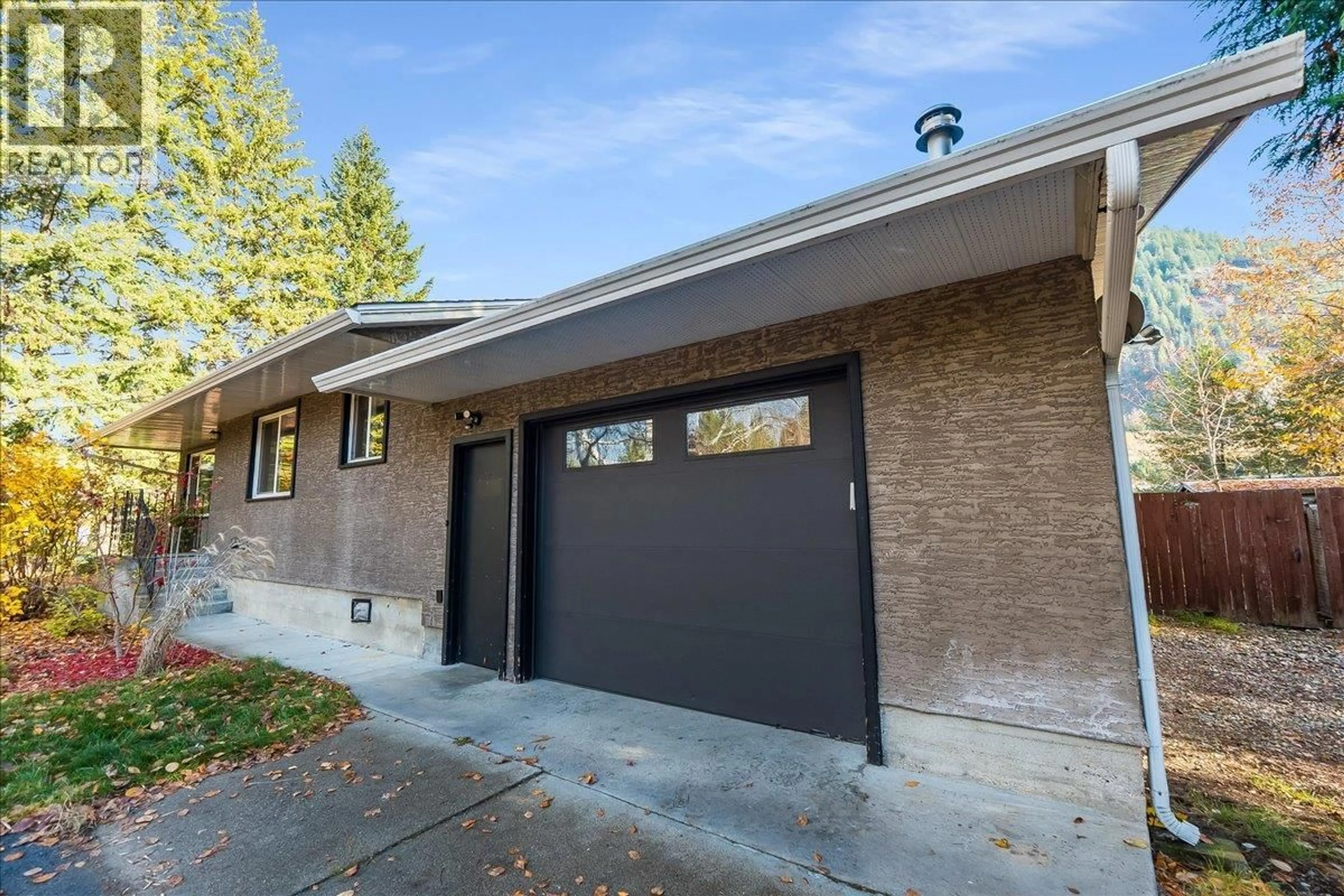 Home with brick exterior material, street for 940 COLUMBIA ROAD, Castlegar British Columbia V1N4K5