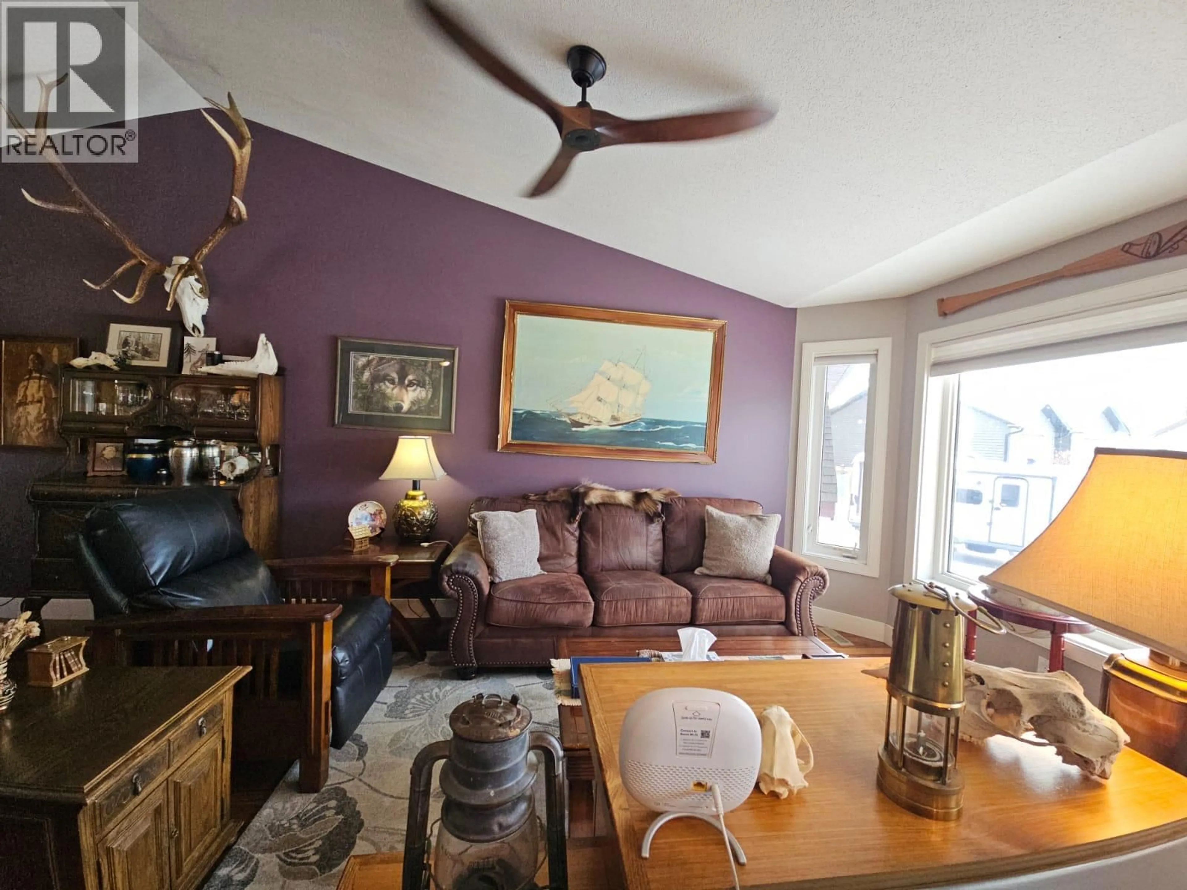 Living room with furniture, wood/laminate floor for 84 WOLVERINE AVENUE, Tumbler Ridge British Columbia V0C2W0