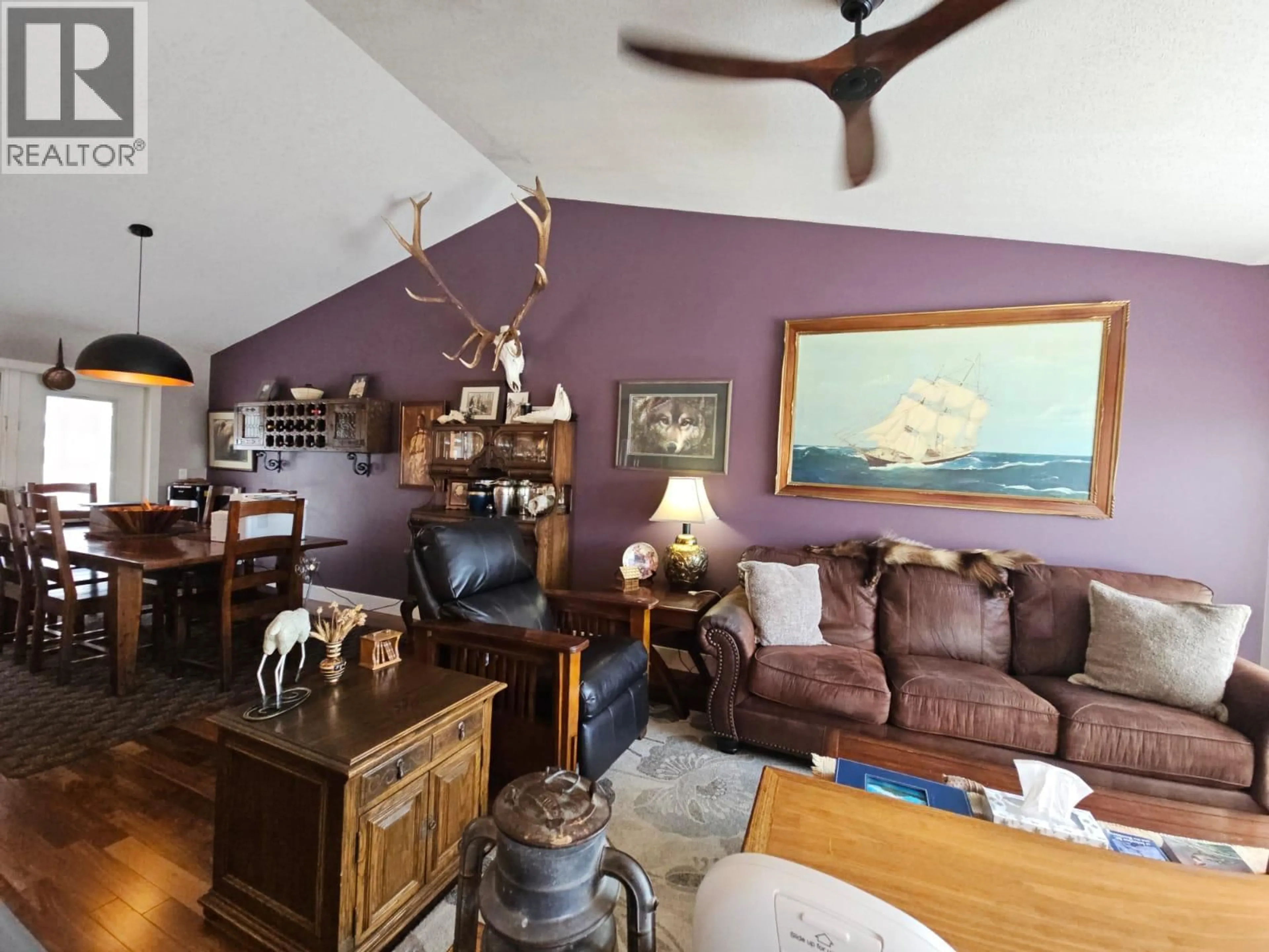 Living room with furniture, wood/laminate floor for 84 WOLVERINE AVENUE, Tumbler Ridge British Columbia V0C2W0