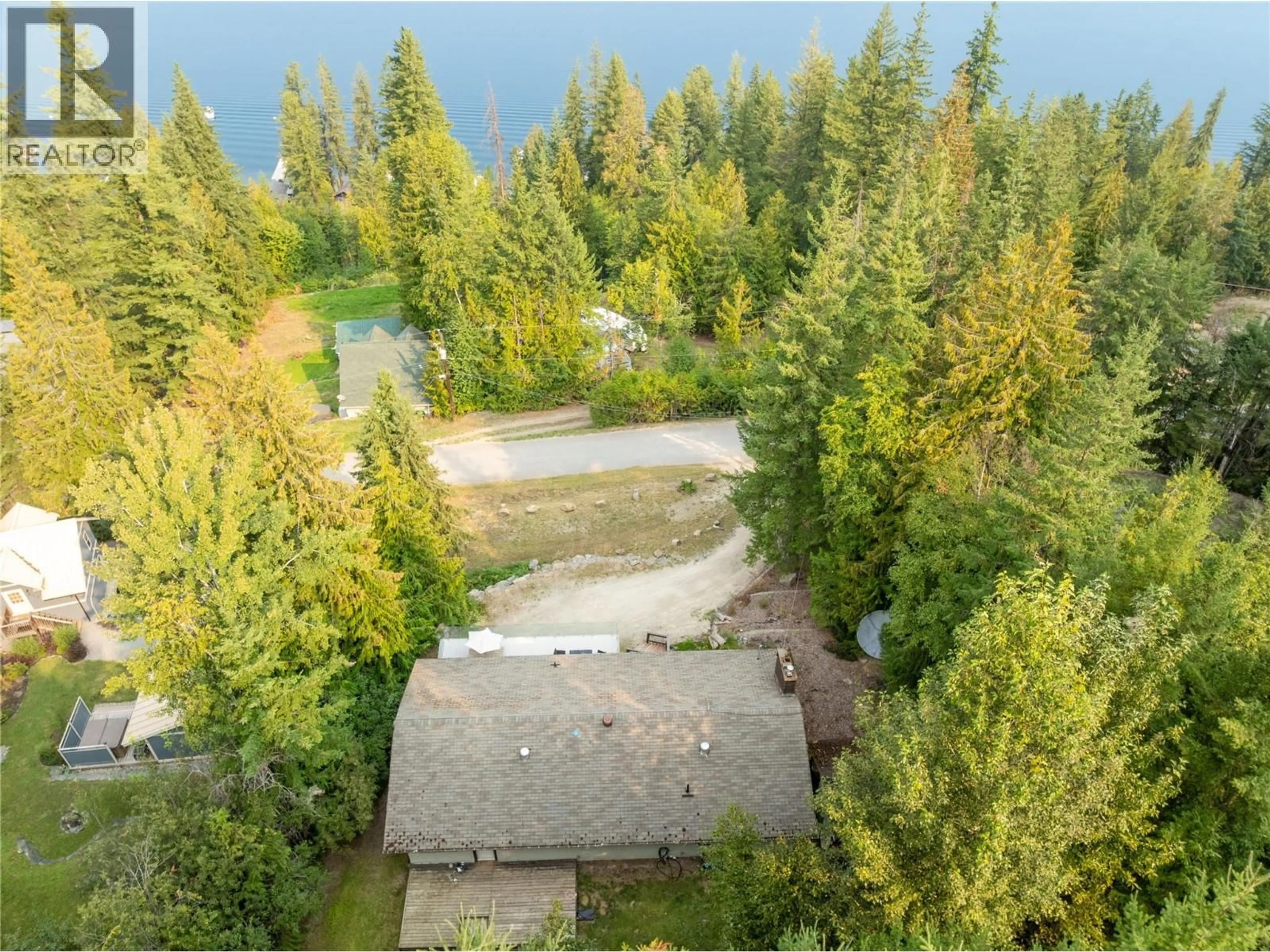 A pic from outside/outdoor area/front of a property/back of a property/a pic from drone, water/lake/river/ocean view for 4018 GREAVES ROAD, Eagle Bay British Columbia V0E1T0