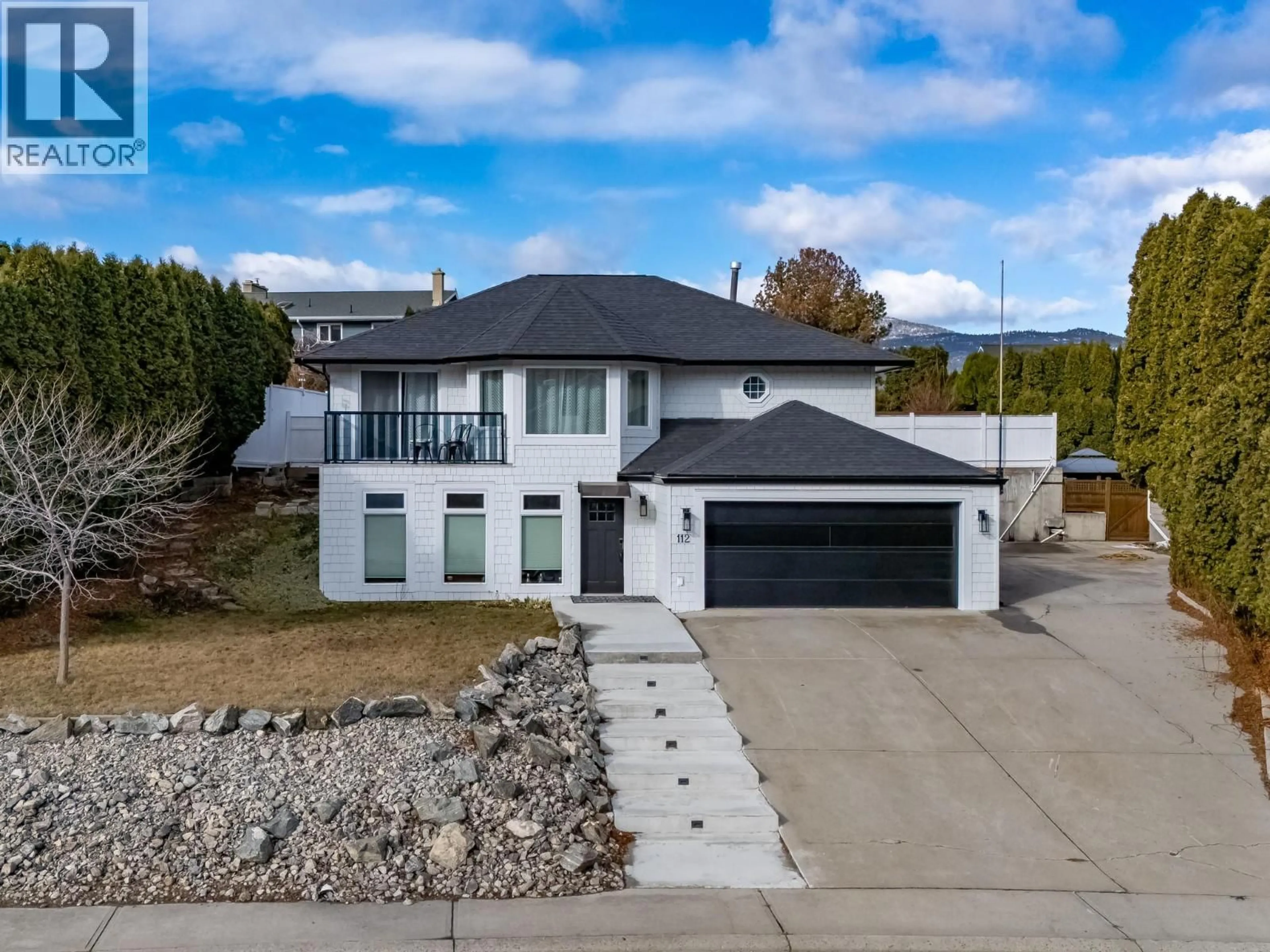 A pic from outside/outdoor area/front of a property/back of a property/a pic from drone, street for 112 UPLANDS PLACE, Penticton British Columbia V2A7Y1