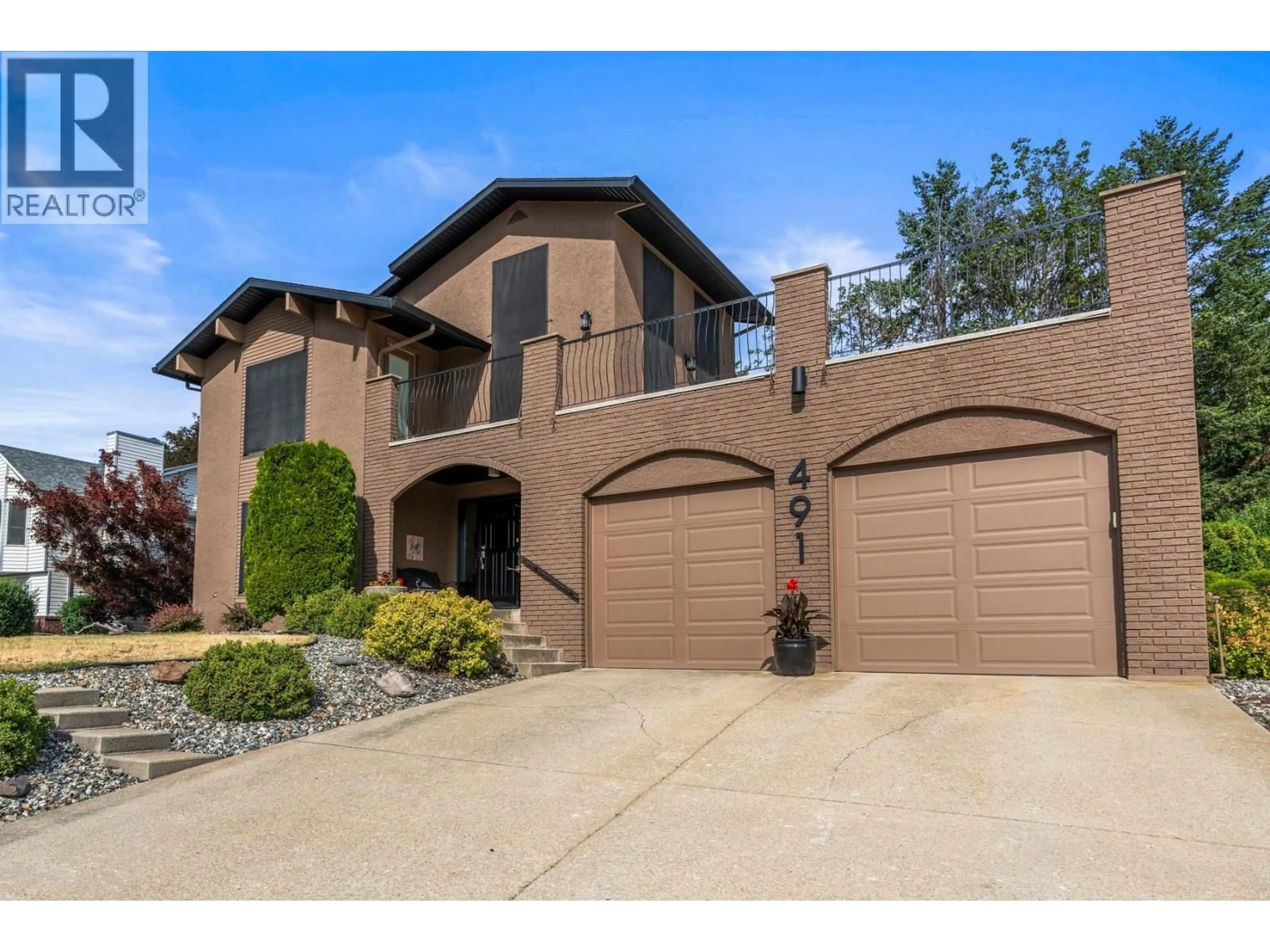 Home with brick exterior material, street for 491 TERRACE DRIVE, Coldstream British Columbia V1B2W9