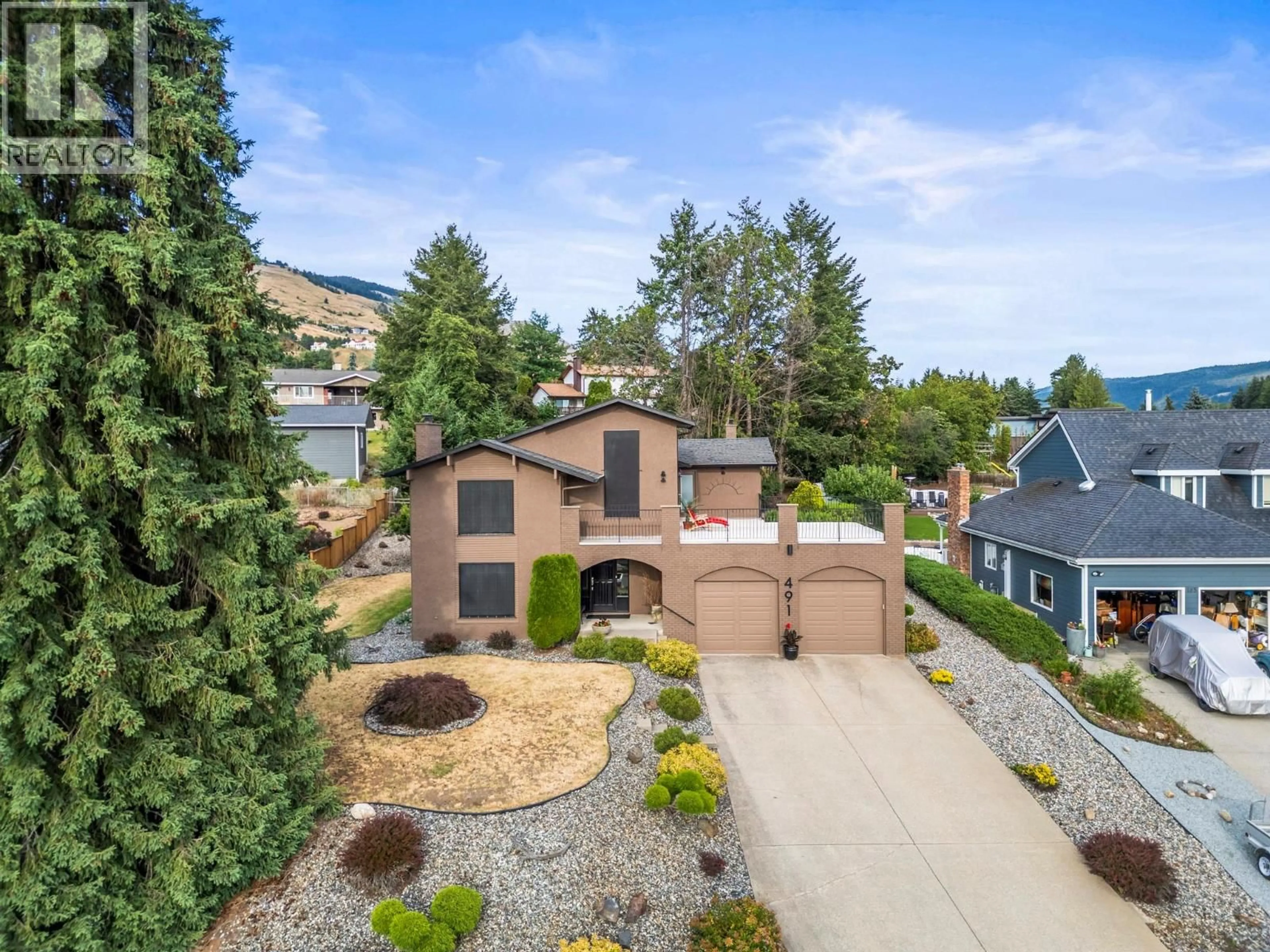 A pic from outside/outdoor area/front of a property/back of a property/a pic from drone, street for 491 TERRACE DRIVE, Coldstream British Columbia V1B2W9