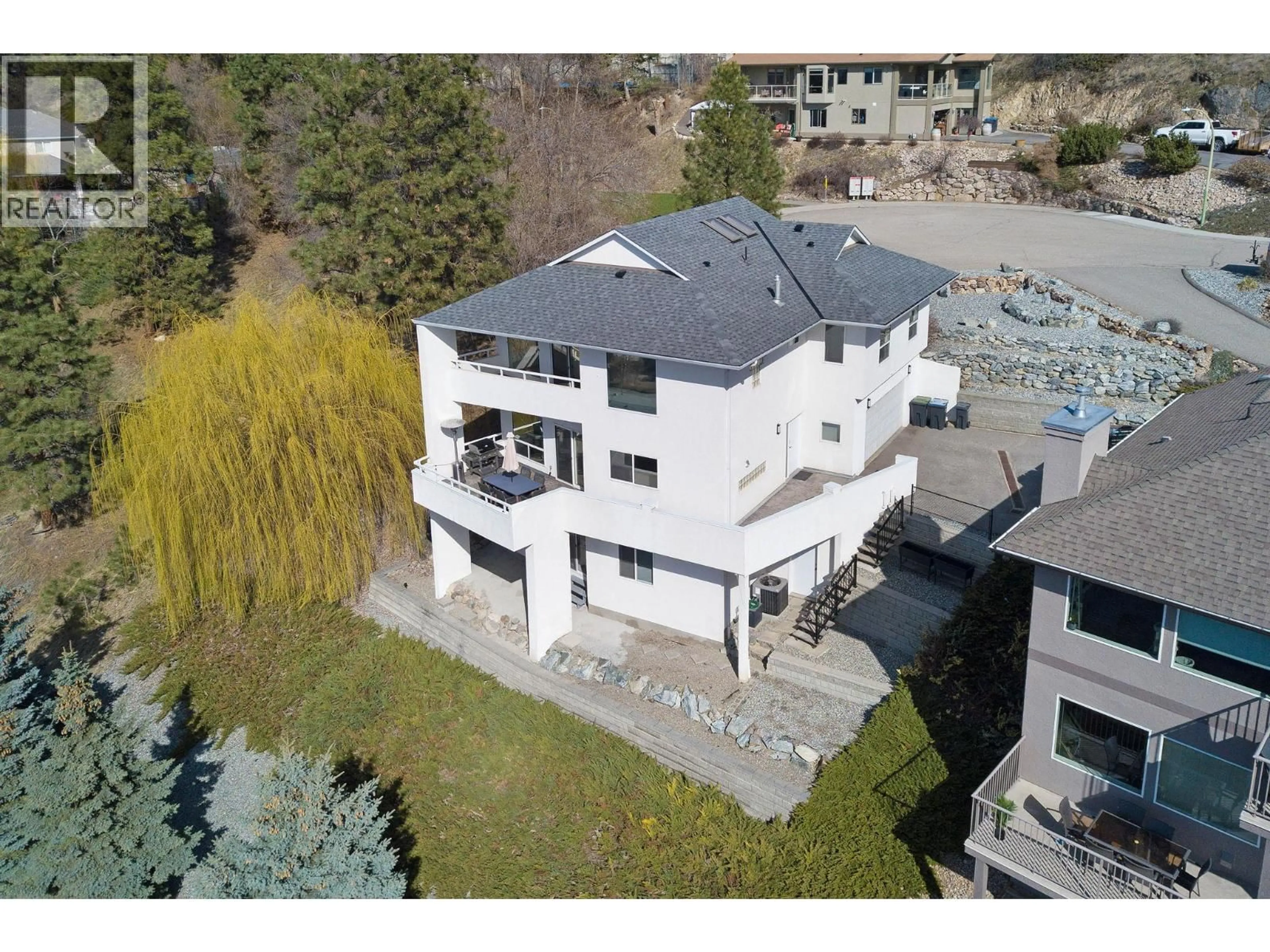 A pic from outside/outdoor area/front of a property/back of a property/a pic from drone, building for 1022 JAMES HOCKEY PLACE, Kelowna British Columbia V1X7L2