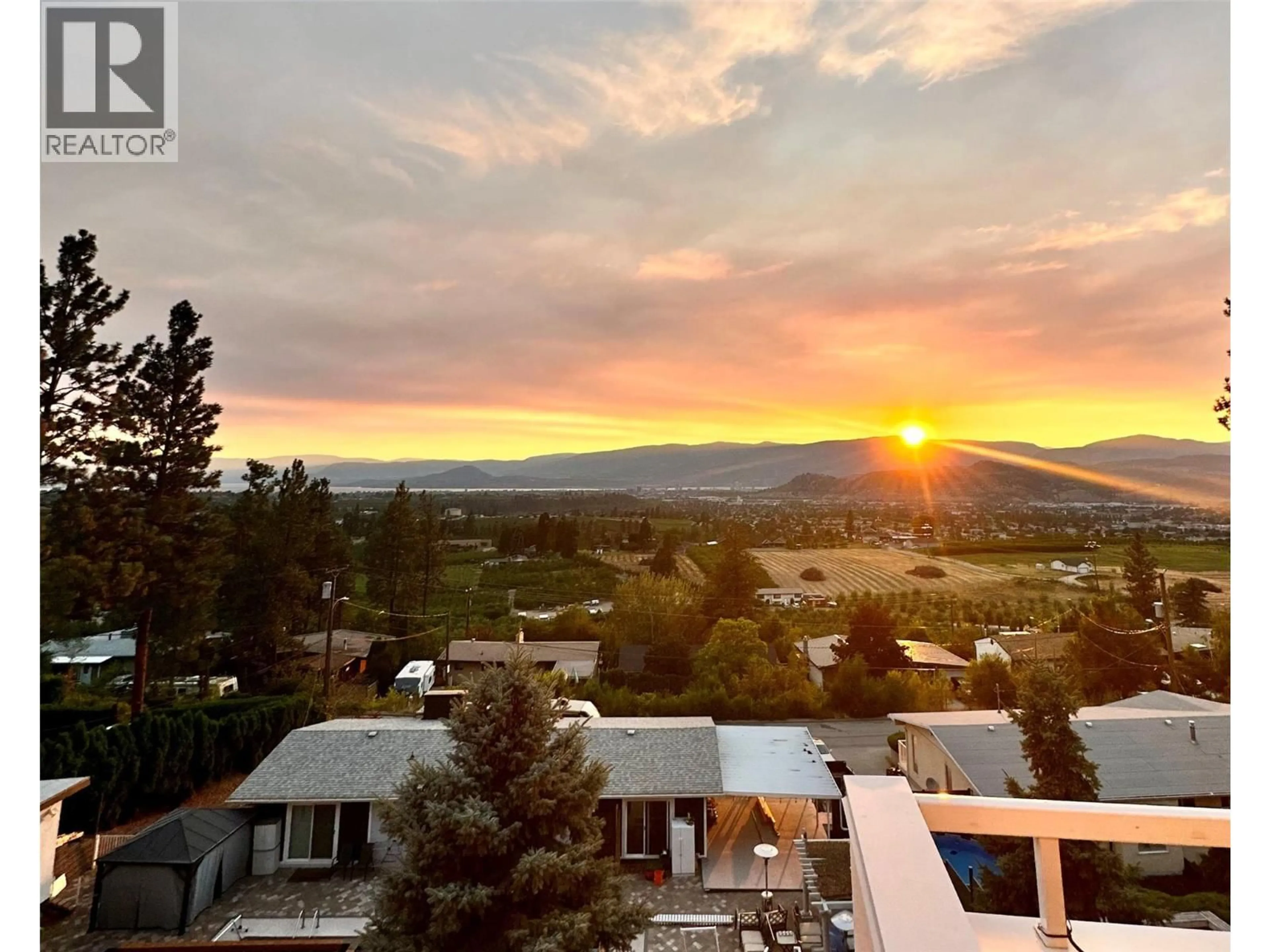 A pic from outside/outdoor area/front of a property/back of a property/a pic from drone, mountain view for 1022 JAMES HOCKEY PLACE, Kelowna British Columbia V1X7L2