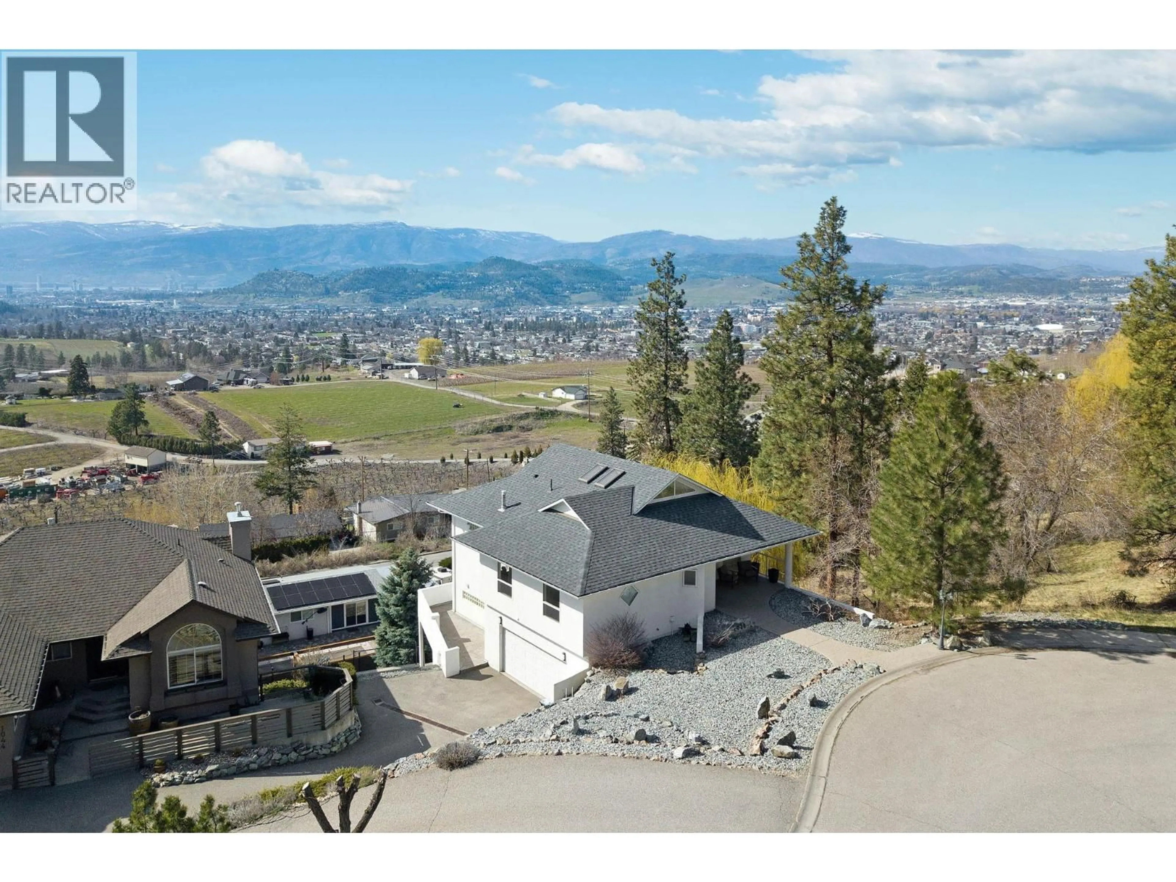 A pic from outside/outdoor area/front of a property/back of a property/a pic from drone, mountain view for 1022 JAMES HOCKEY PLACE, Kelowna British Columbia V1X7L2