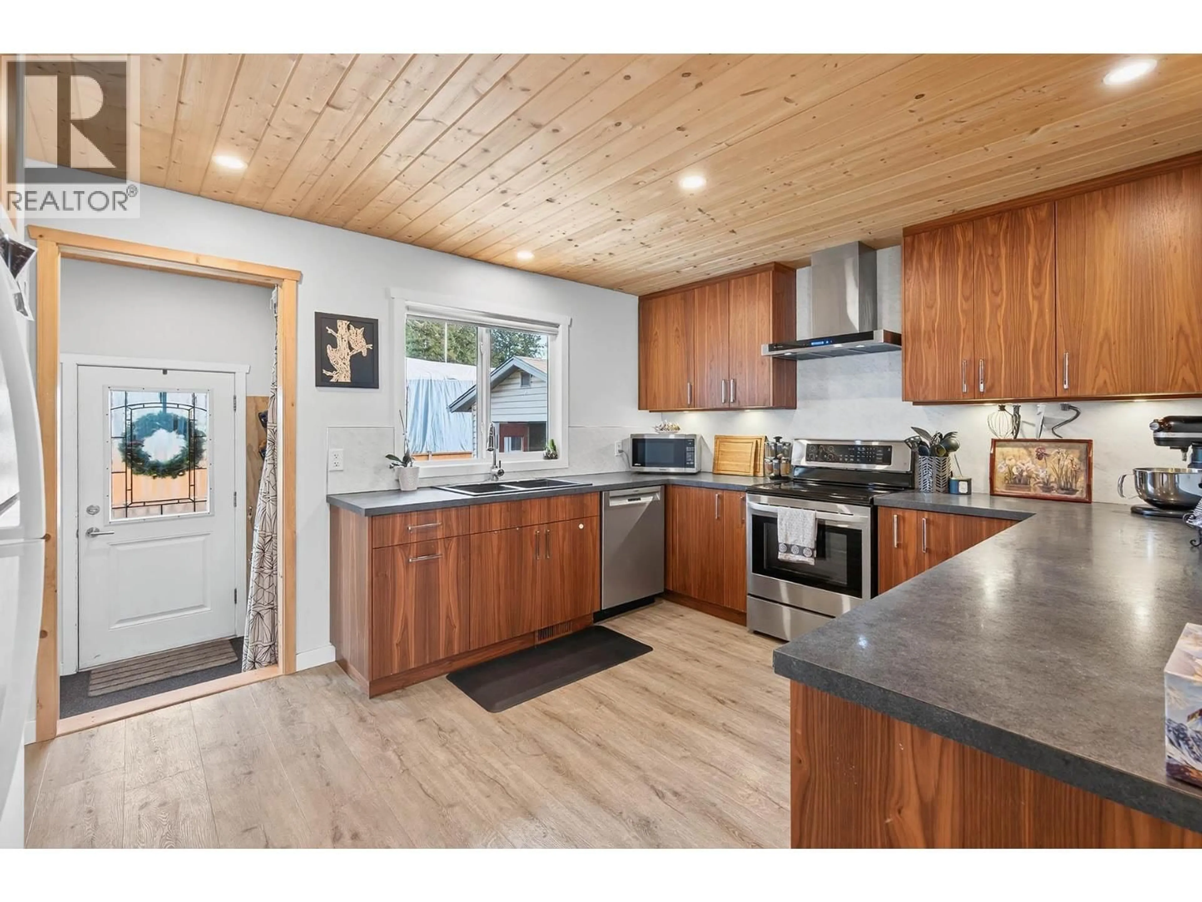 Open concept kitchen, wood/laminate floor for 358 HELMCKEN STREET, Clearwater British Columbia V0E1N1