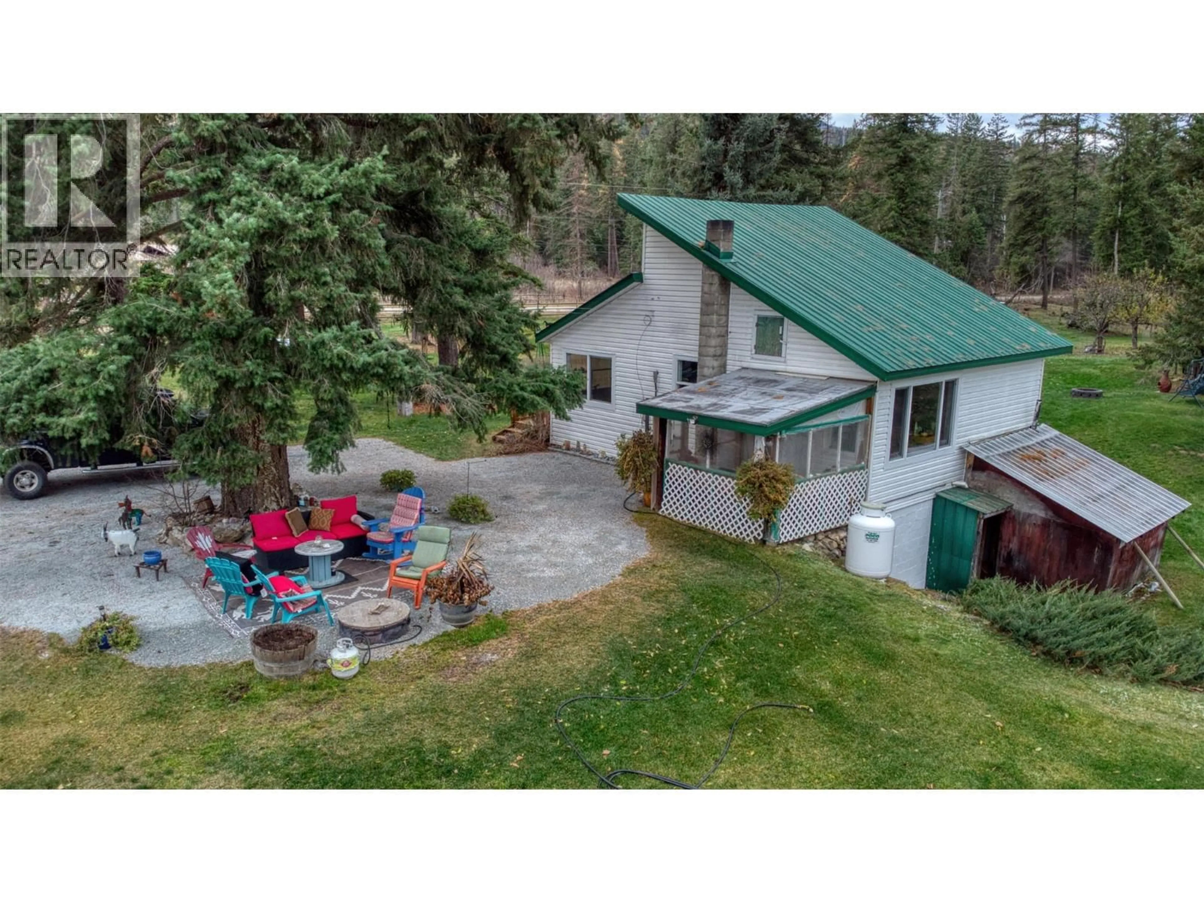 A pic from outside/outdoor area/front of a property/back of a property/a pic from drone, mountain view for 1385 6 HIGHWAY, Cherryville British Columbia V0E2G1
