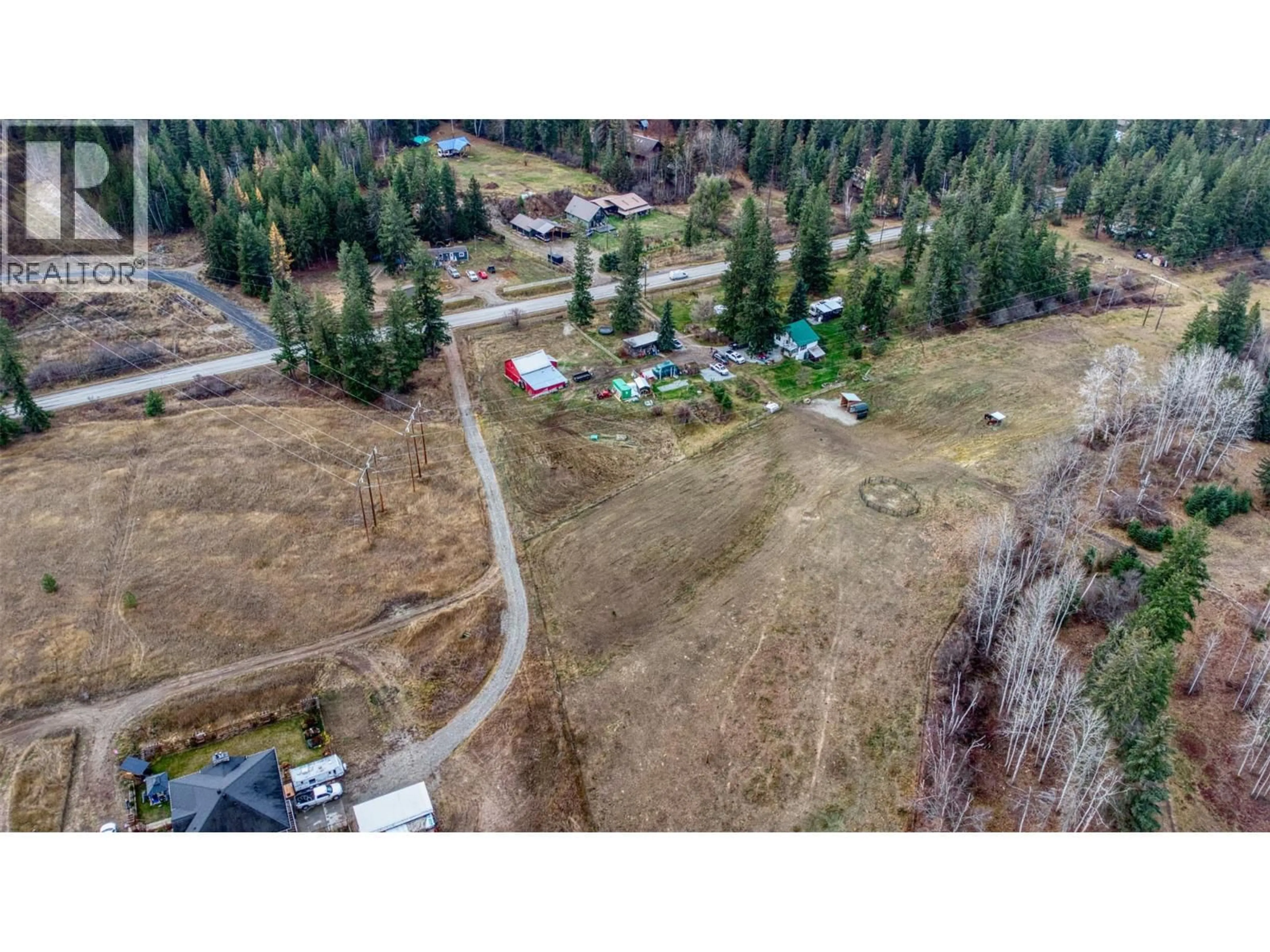 A pic from outside/outdoor area/front of a property/back of a property/a pic from drone, mountain view for 1385 6 HIGHWAY, Cherryville British Columbia V0E2G1