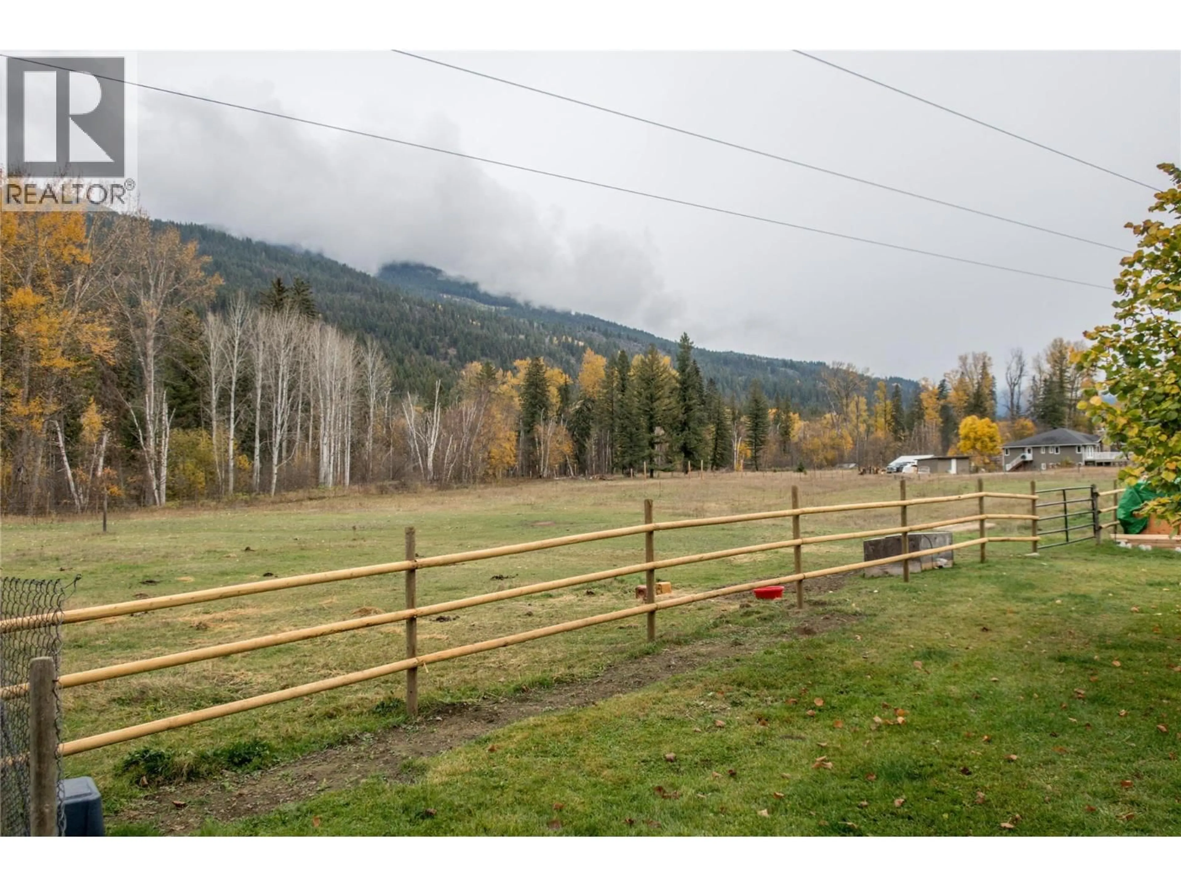 A pic from outside/outdoor area/front of a property/back of a property/a pic from drone, mountain view for 1385 6 HIGHWAY, Cherryville British Columbia V0E2G1