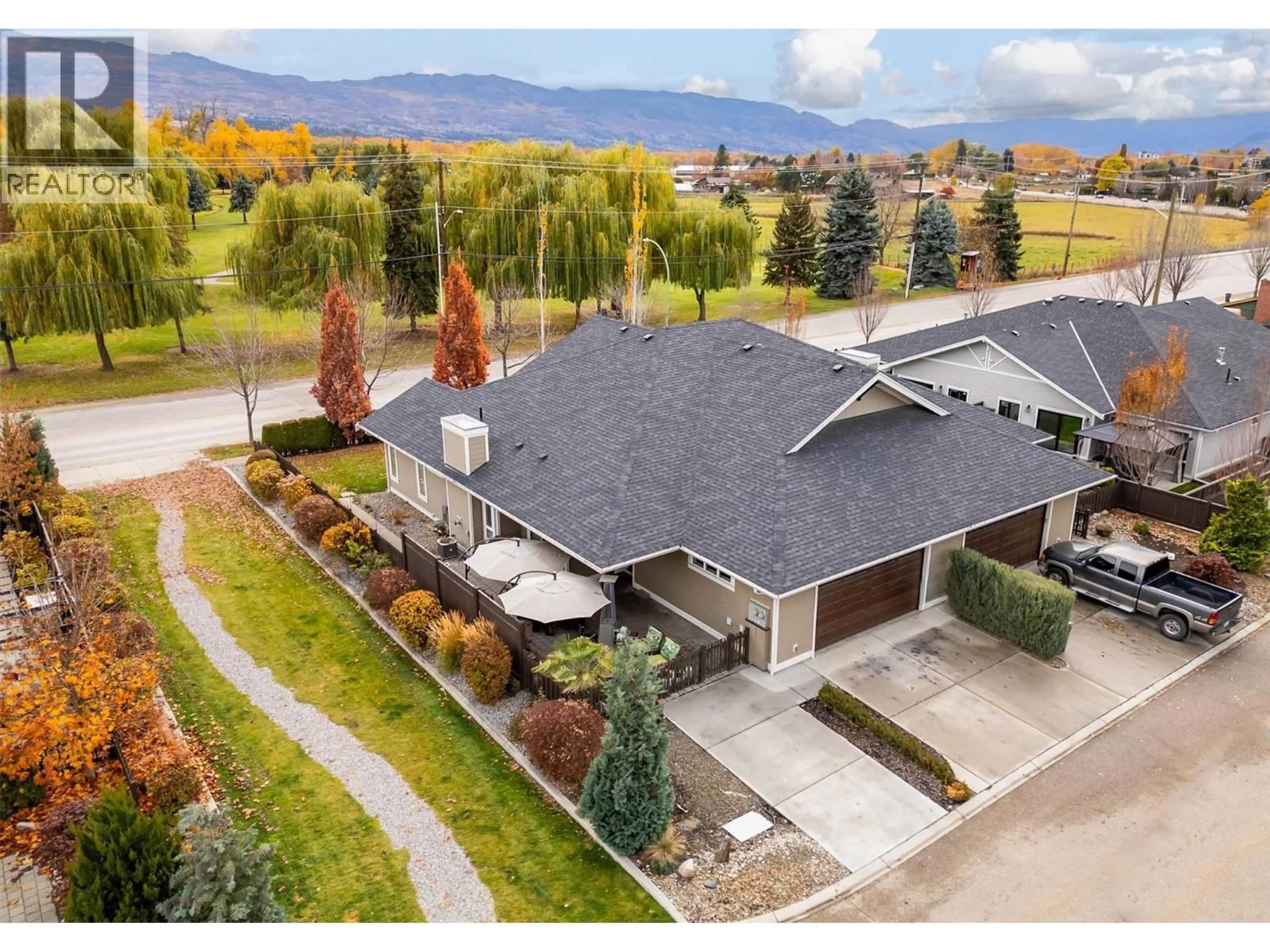 A pic from outside/outdoor area/front of a property/back of a property/a pic from drone, mountain view for 11 - 1960 KLO ROAD, Kelowna British Columbia V1W5L2