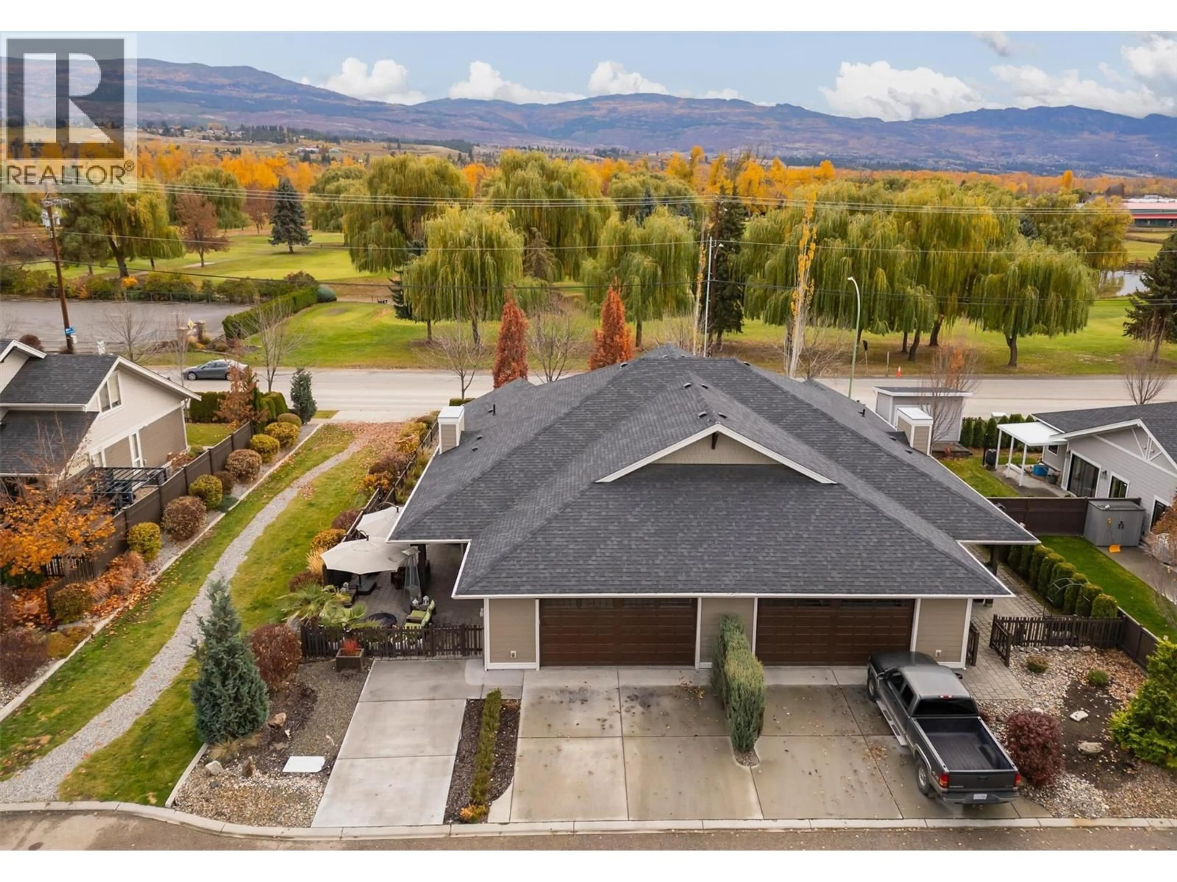 A pic from outside/outdoor area/front of a property/back of a property/a pic from drone, mountain view for 11 - 1960 KLO ROAD, Kelowna British Columbia V1W5L2