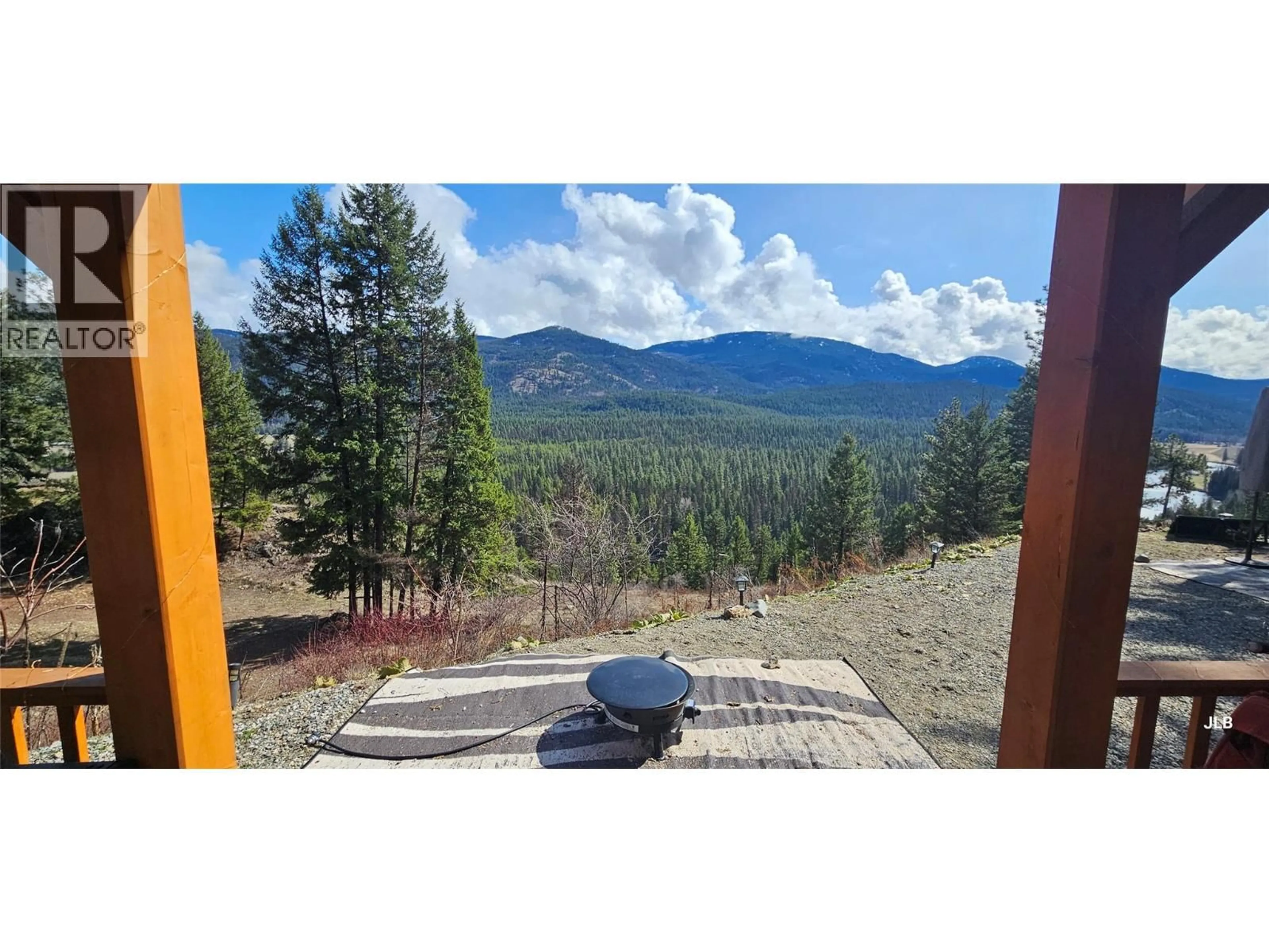 A pic from outside/outdoor area/front of a property/back of a property/a pic from drone, forest/trees view for 17KM CHRISTIAN VALLEY ROAD, Westbridge British Columbia V0H1Y0