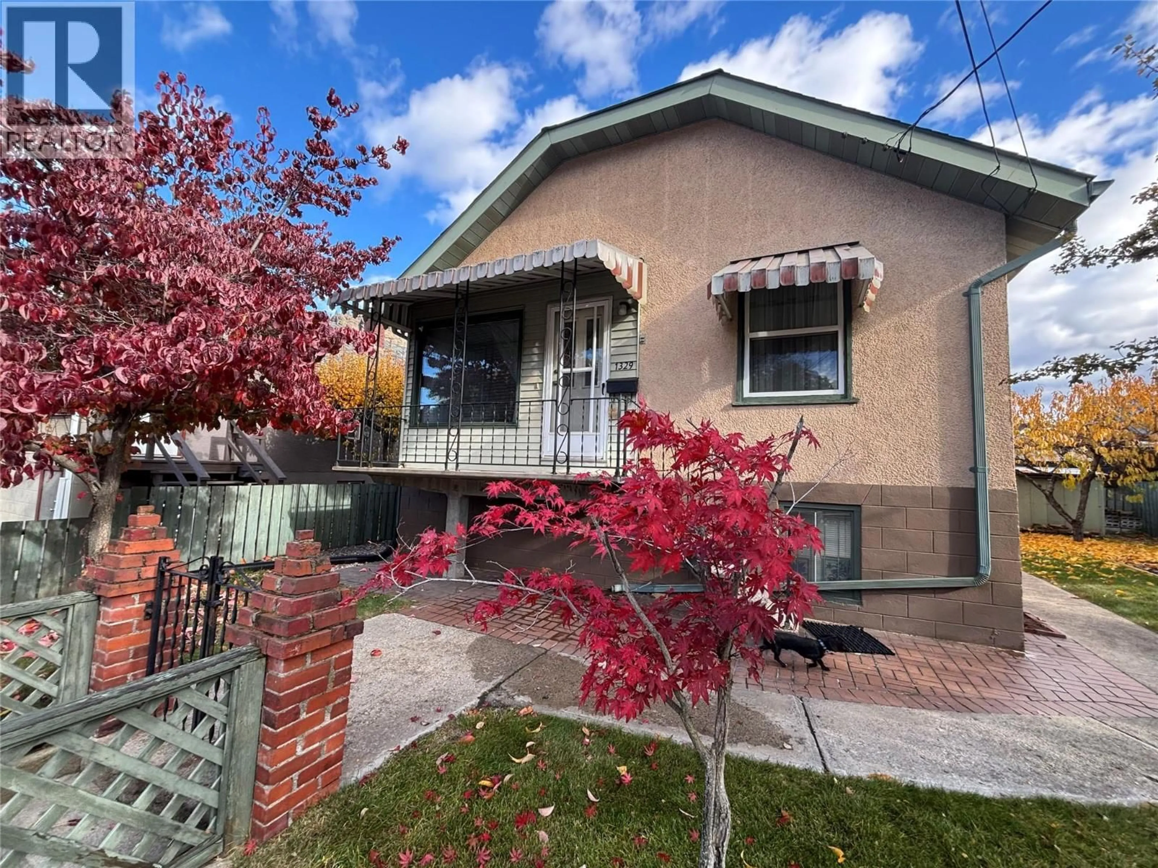 Home with brick exterior material, street for 1329 COLUMBIA AVENUE, Trail British Columbia V1R1J5