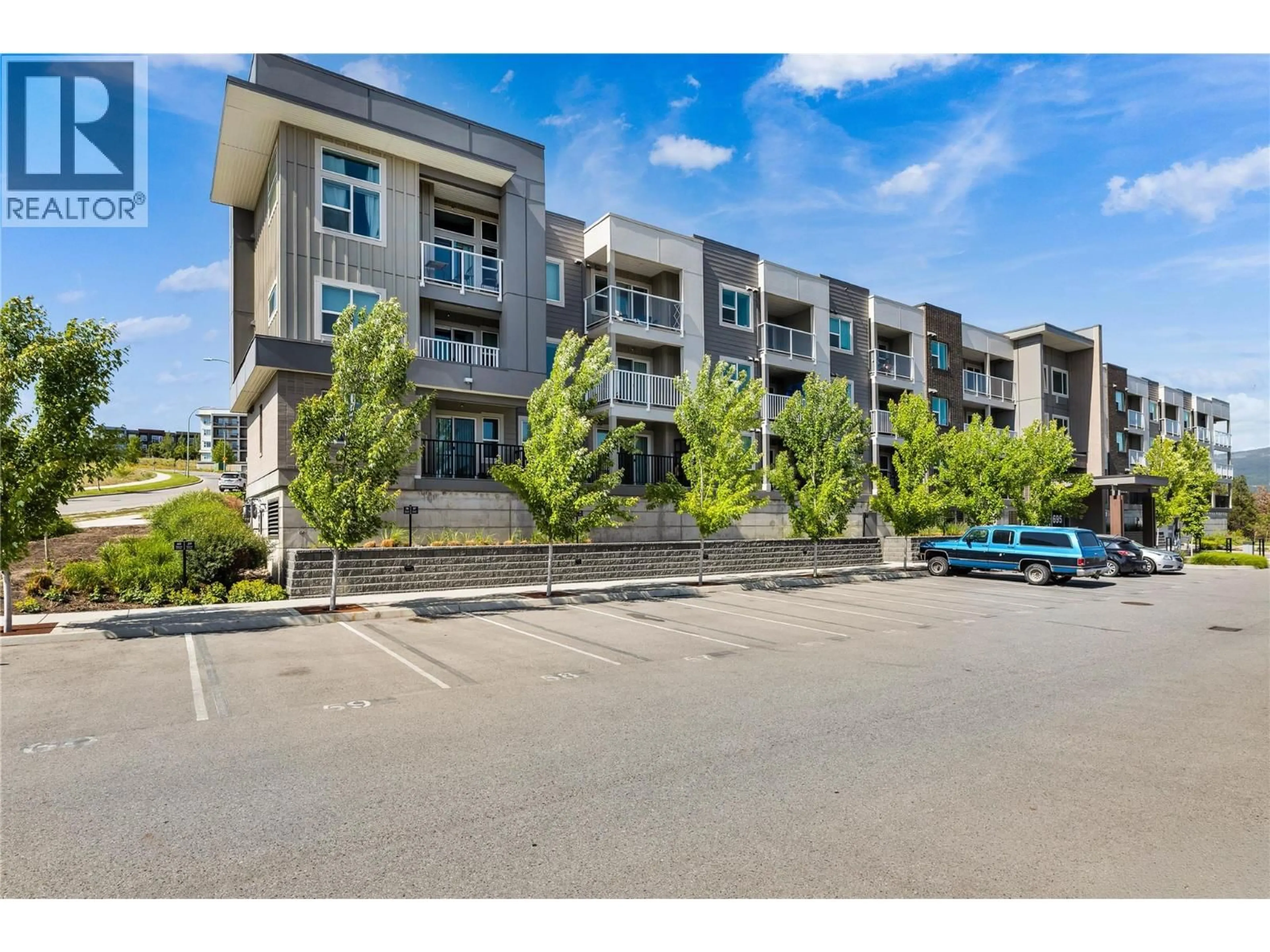 A pic from outside/outdoor area/front of a property/back of a property/a pic from drone, unknown for 119 - 695 ACADEMY WAY, Kelowna British Columbia V1V0C7