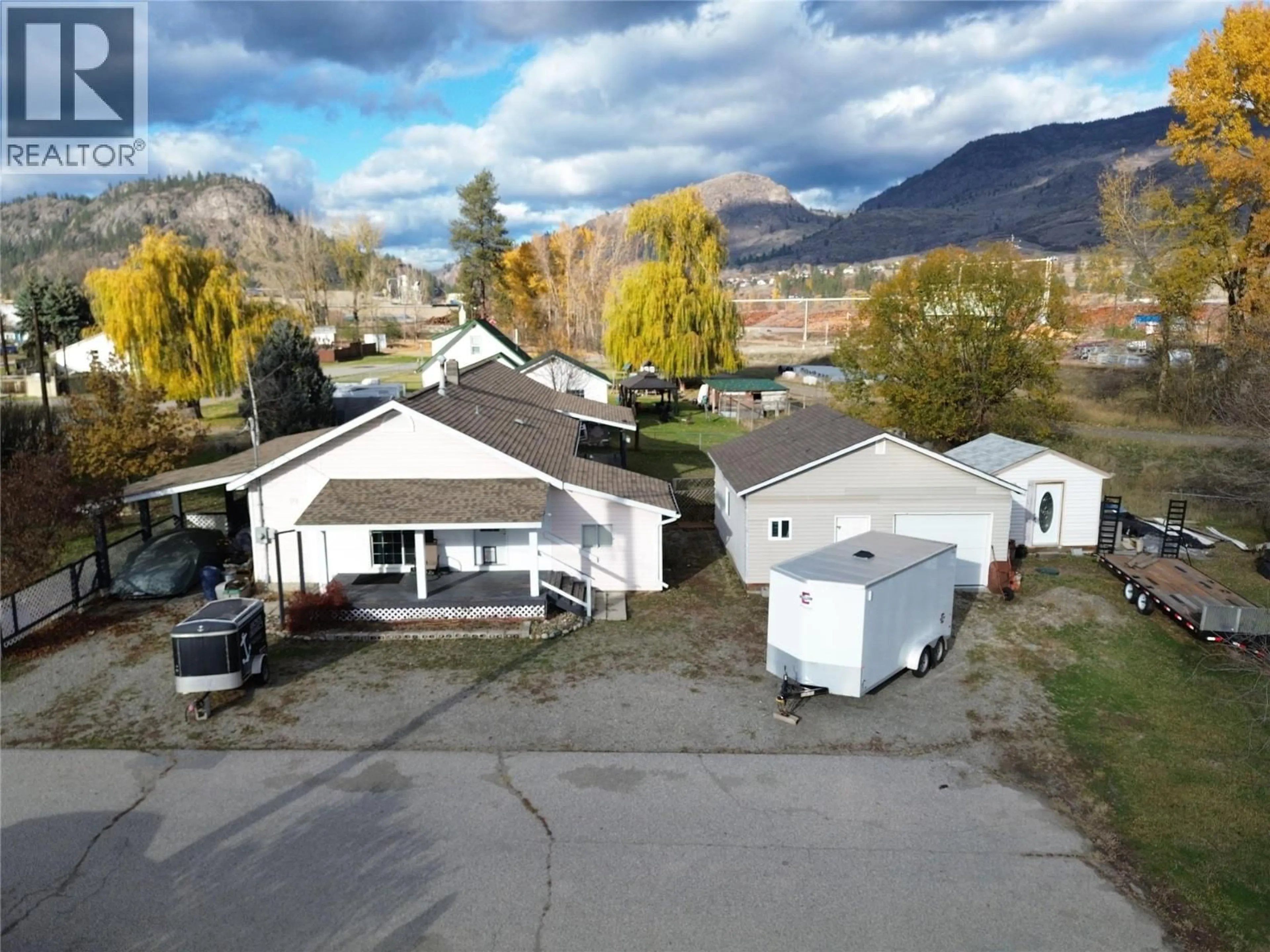 A pic from outside/outdoor area/front of a property/back of a property/a pic from drone, mountain view for 6408 5TH STREET, Grand Forks British Columbia V0H1H4