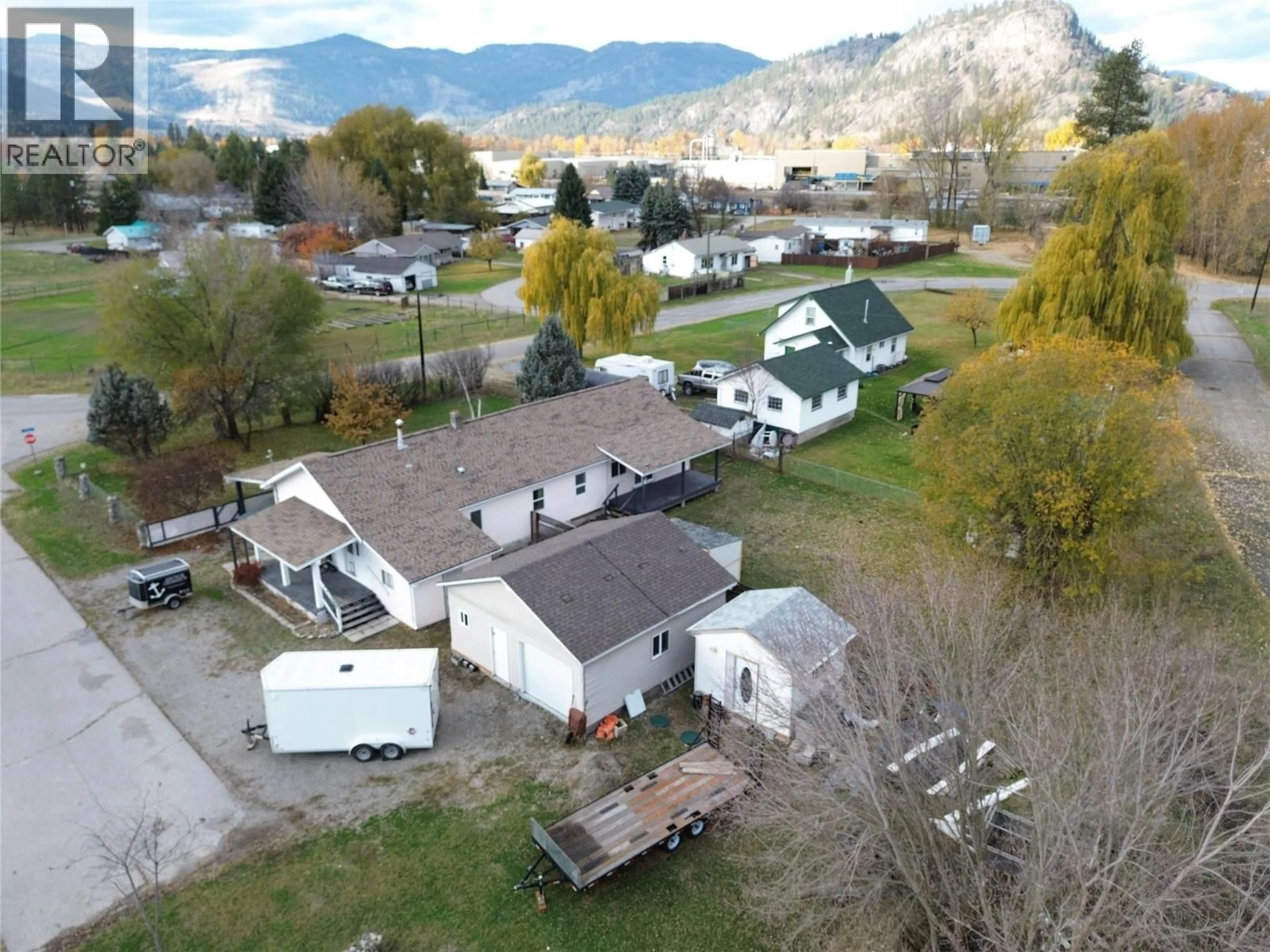 A pic from outside/outdoor area/front of a property/back of a property/a pic from drone, mountain view for 6408 5TH STREET, Grand Forks British Columbia V0H1H4