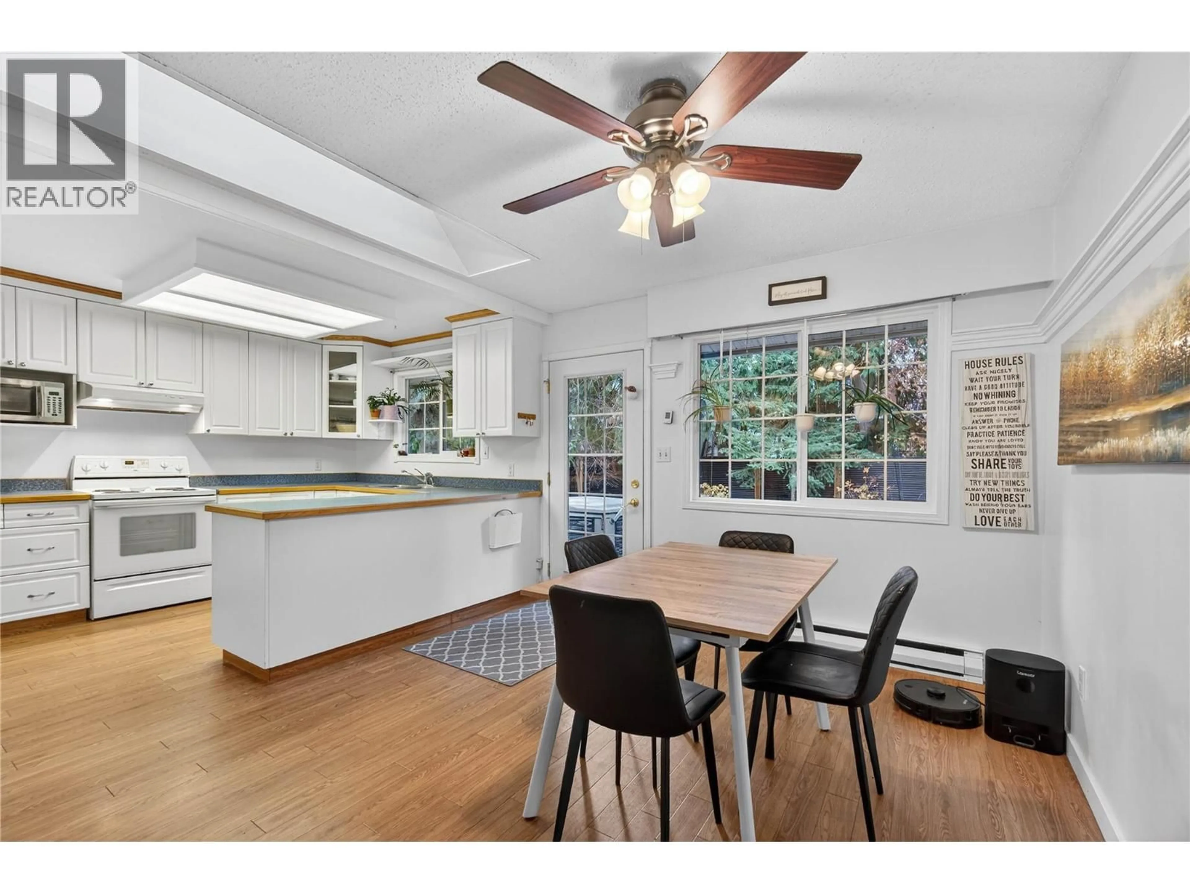 Open concept kitchen, wood/laminate floor for 705 SPRUCE STREET, Sicamous British Columbia V0E2V0