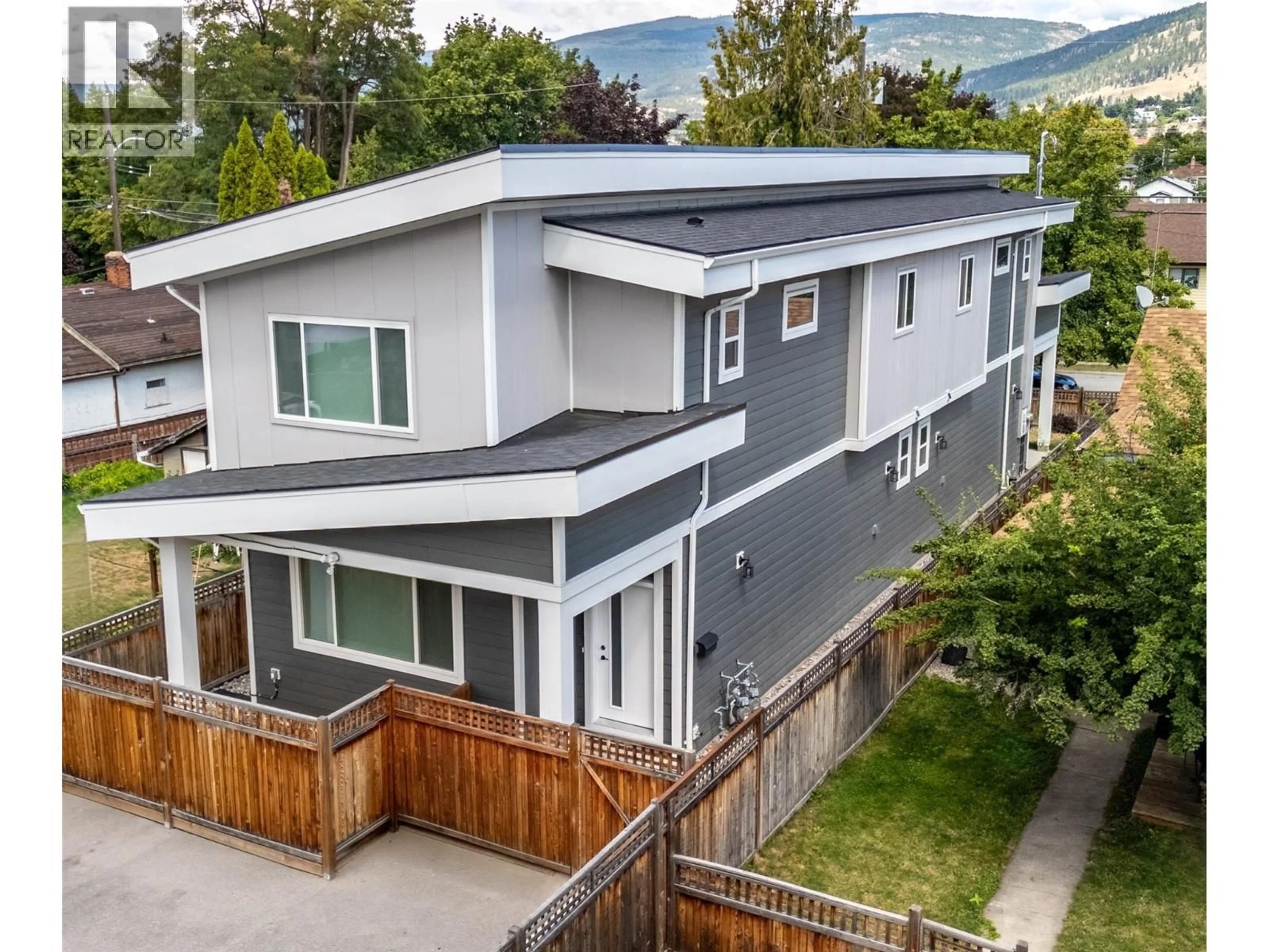 A pic from outside/outdoor area/front of a property/back of a property/a pic from drone, mountain view for 102 - 453 MAURICE STREET, Penticton British Columbia V2A5V8