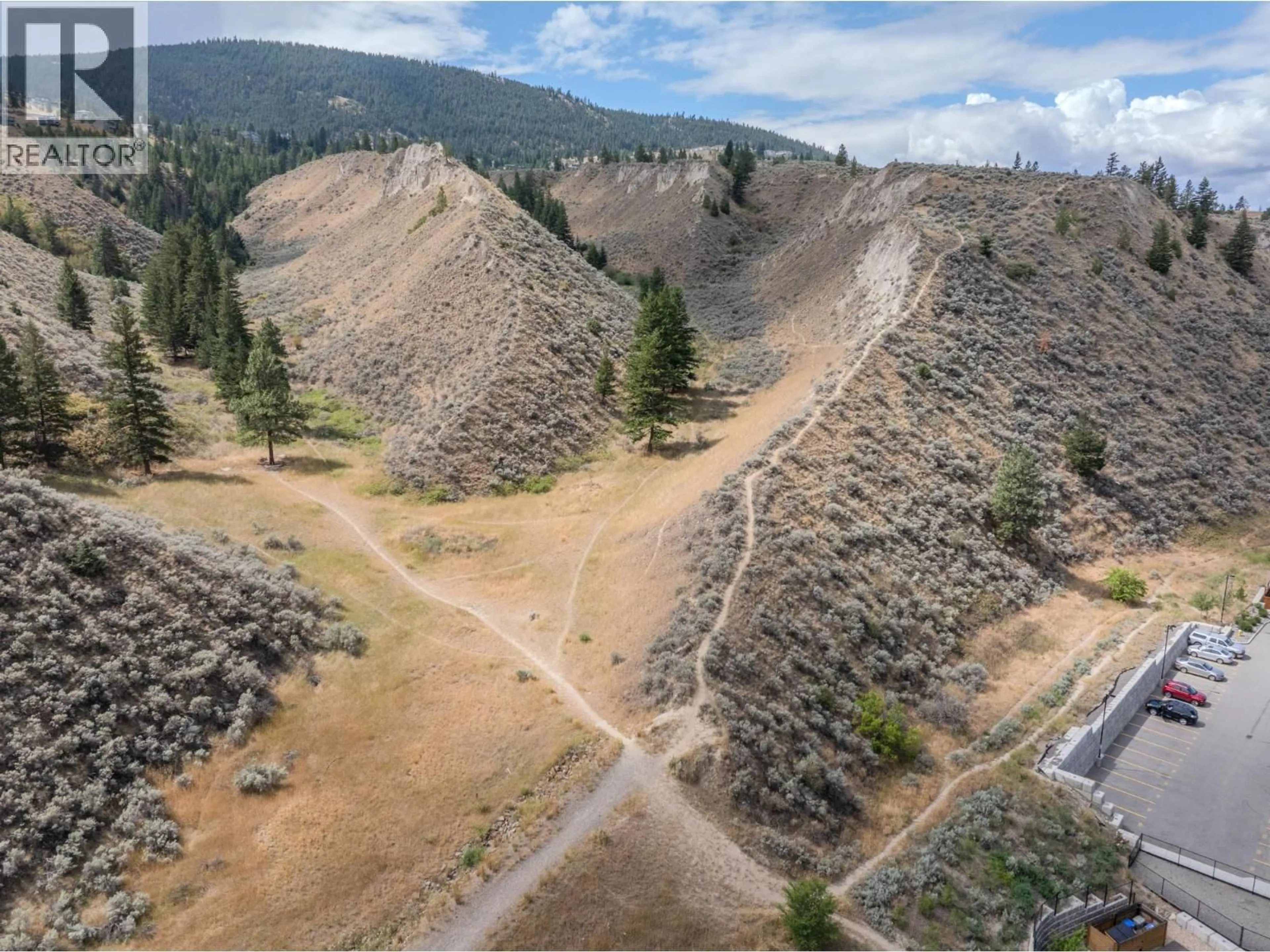 A pic from outside/outdoor area/front of a property/back of a property/a pic from drone, forest/trees view for 162 - 200 GRAND BOULEVARD, Kamloops British Columbia V2C0H3