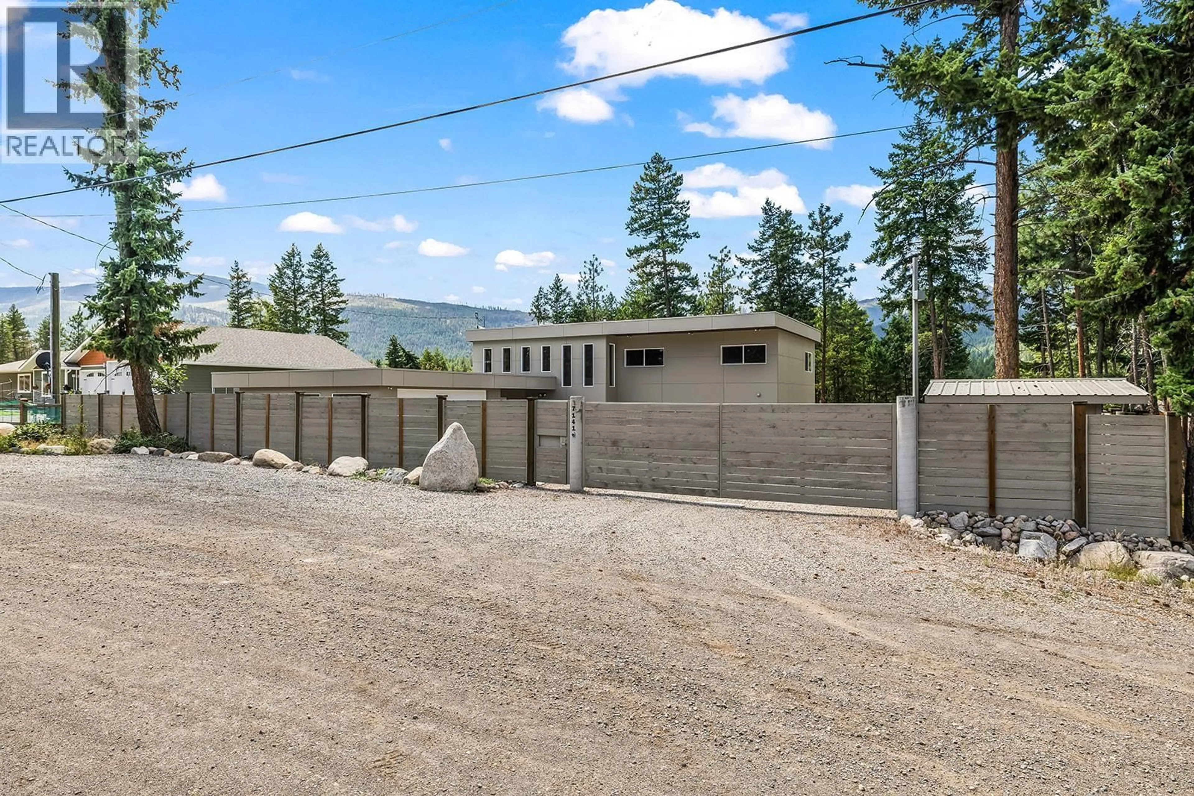 A pic from outside/outdoor area/front of a property/back of a property/a pic from drone, mountain view for 7141 DUNWATERS ROAD, Kelowna British Columbia V1Z3W5