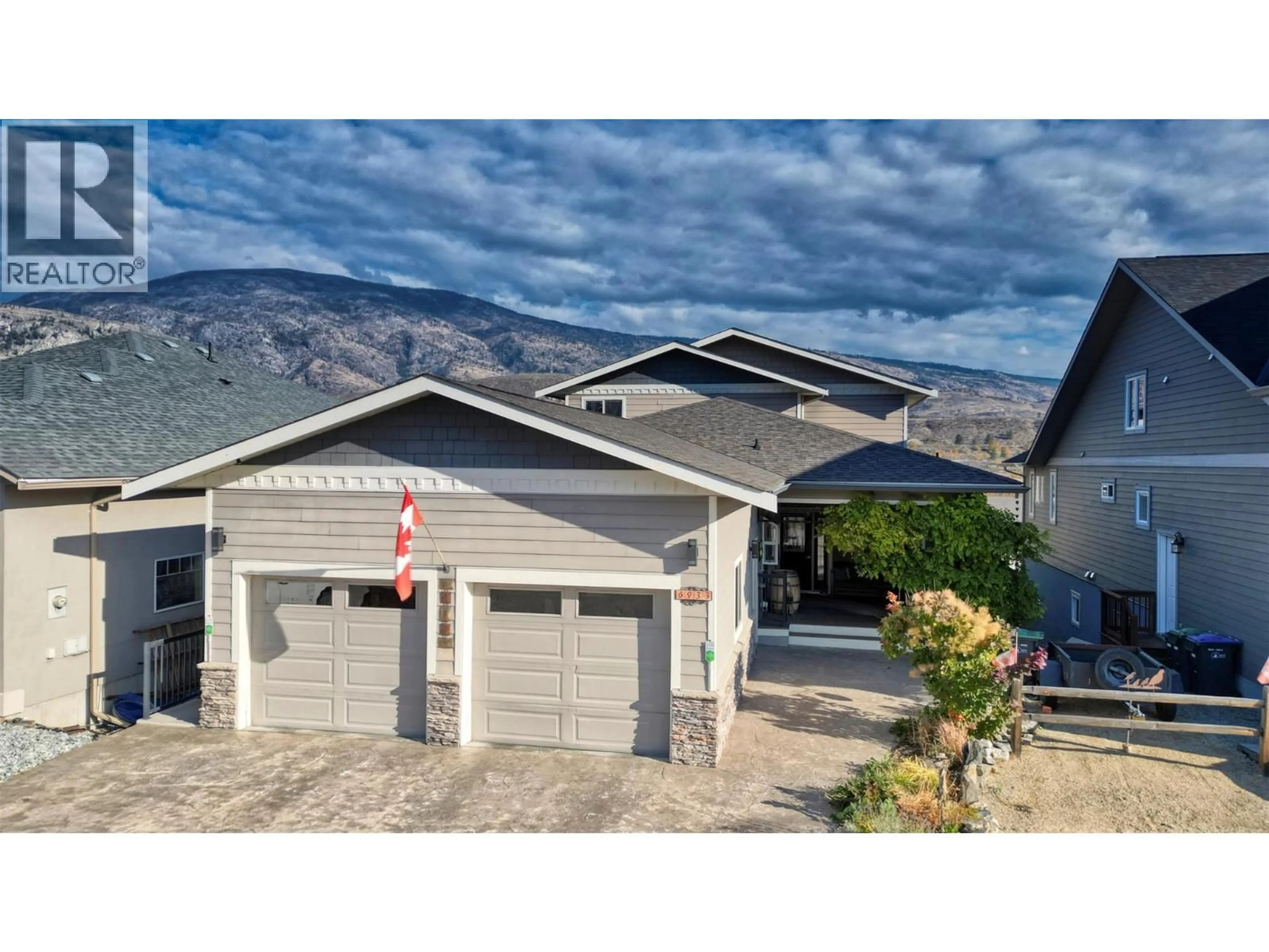 Home with vinyl exterior material, mountain view for 6933 MOUNTAINVIEW DRIVE, Oliver British Columbia V0H1T4
