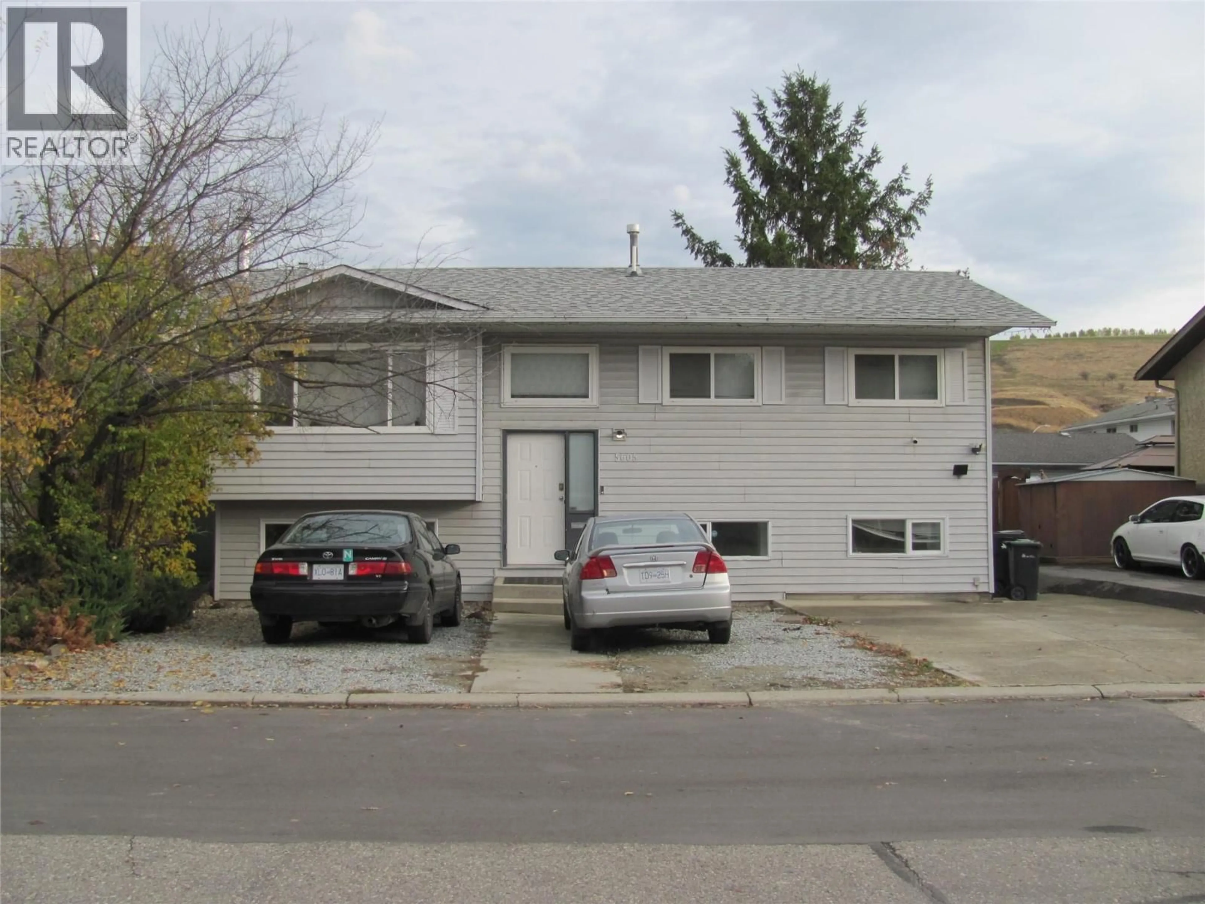 Home with vinyl exterior material, street for 5605 WILLOW DRIVE, Vernon British Columbia V1T7W3