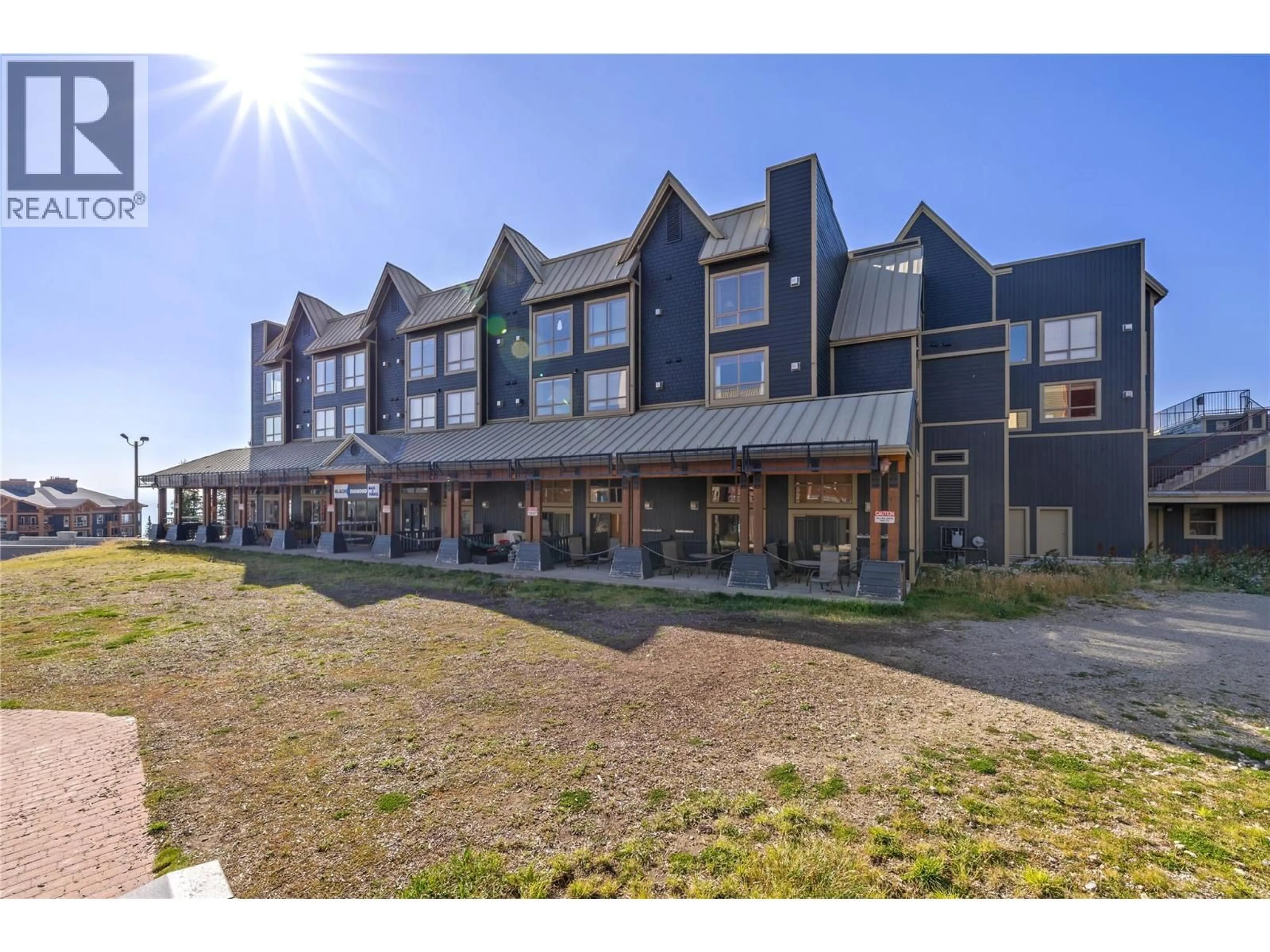 A pic from outside/outdoor area/front of a property/back of a property/a pic from drone, unknown for 220 - 5335 BIG WHITE ROAD, Big White British Columbia V1P1T4