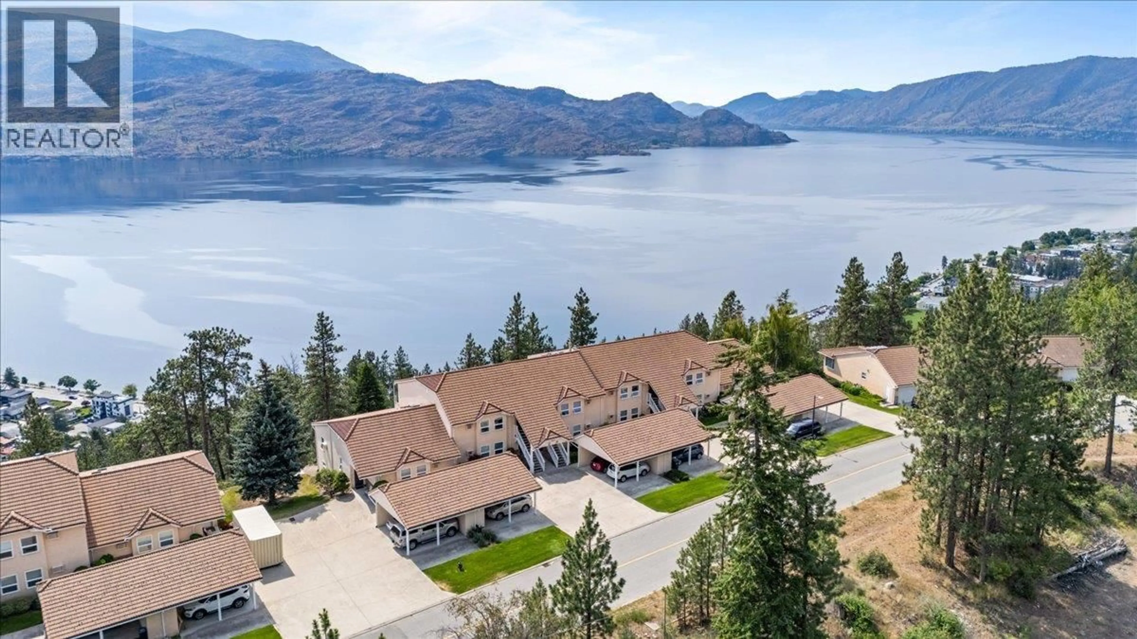 A pic from outside/outdoor area/front of a property/back of a property/a pic from drone, water/lake/river/ocean view for 201 - 4470 PONDEROSA DRIVE, Peachland British Columbia V0H1X5