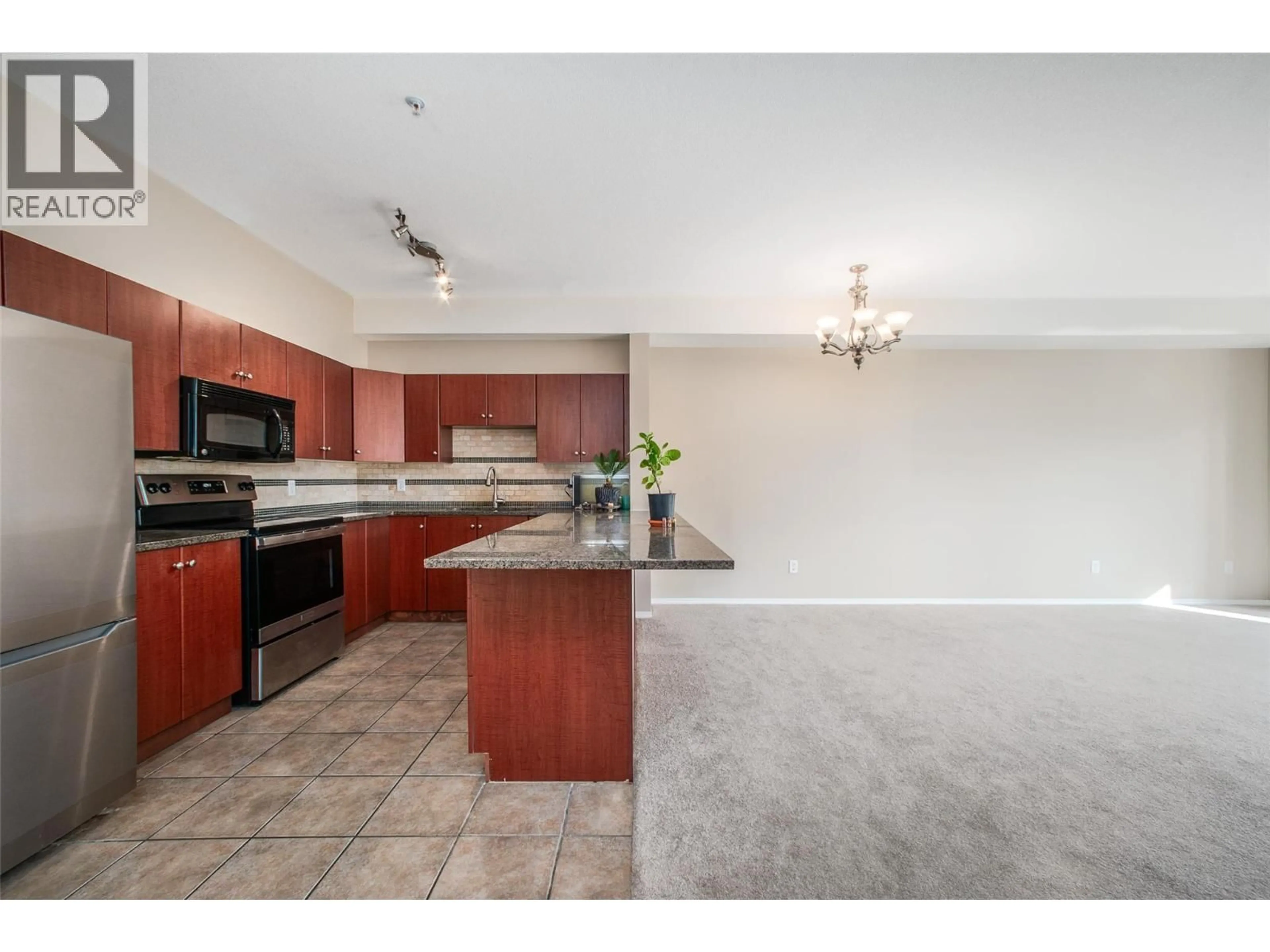 Open concept kitchen, ceramic/tile floor for 1514 - 1875 COUNTRY CLUB DRIVE, Kelowna British Columbia V1V2W7