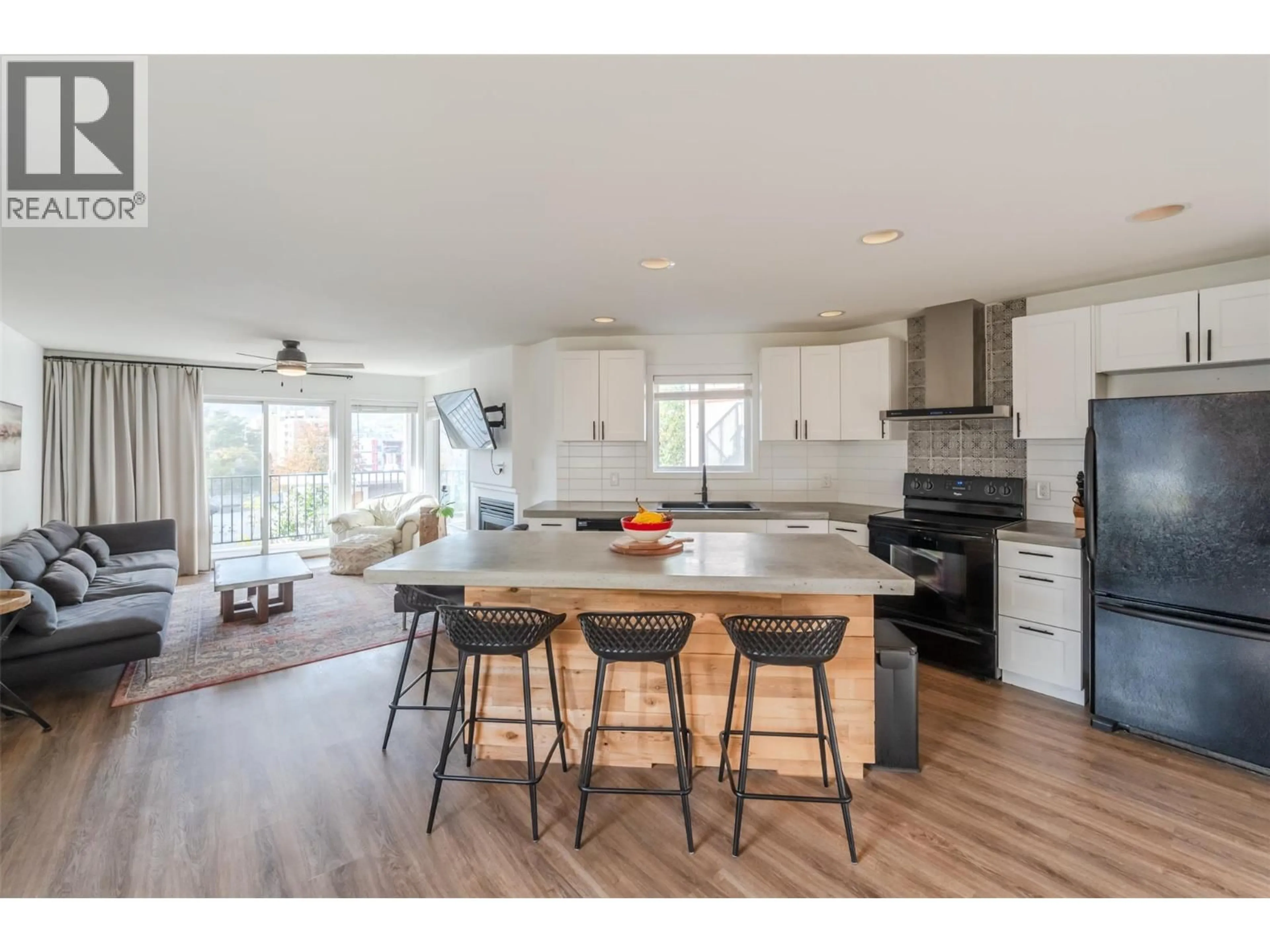 Open concept kitchen, wood/laminate floor for 101 - 93 VAN HORNE STREET, Penticton British Columbia V2A4J9