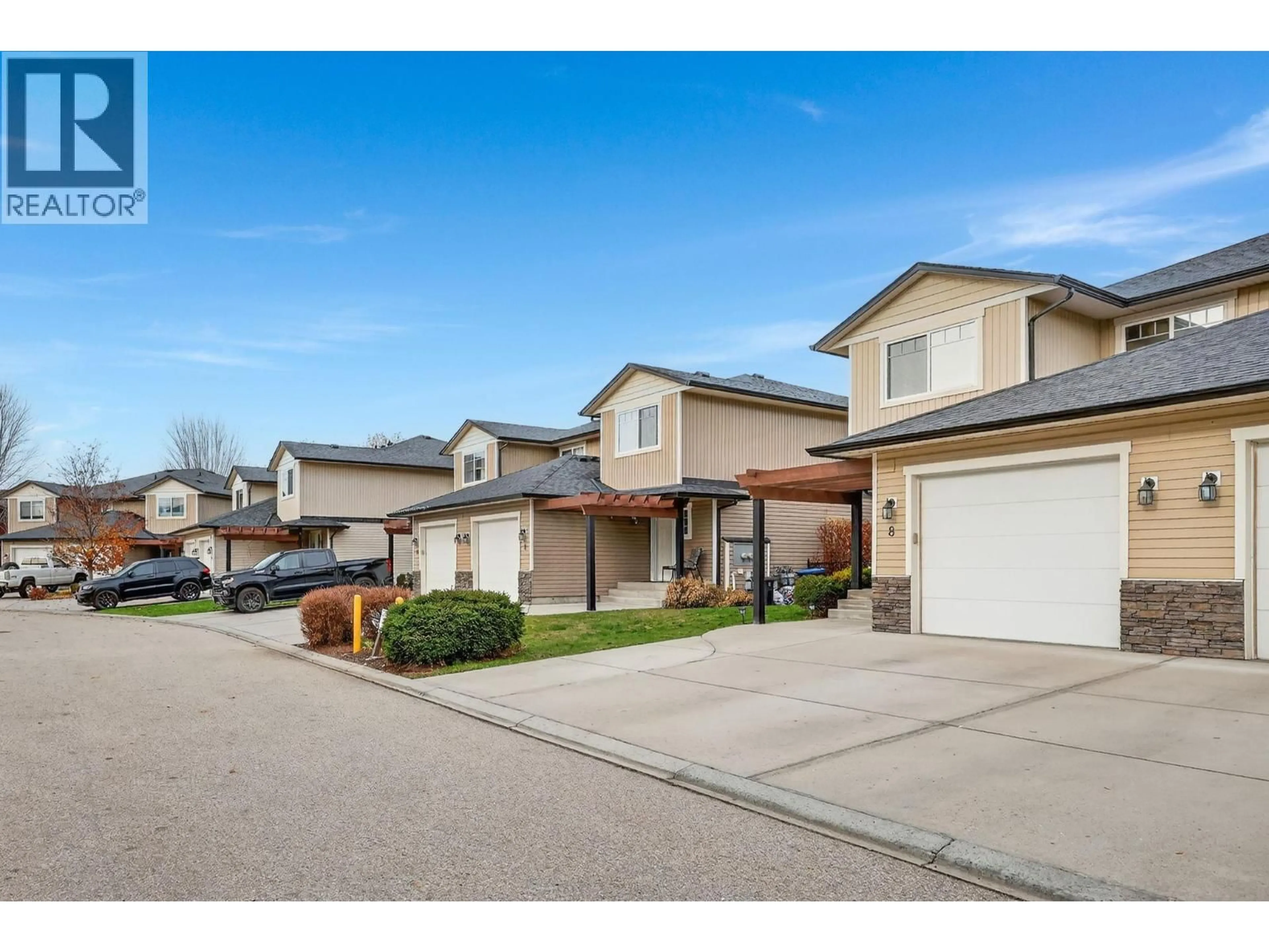 A pic from outside/outdoor area/front of a property/back of a property/a pic from drone, street for 8 - 180 MCCURDY ROAD, Kelowna British Columbia V1X2N9