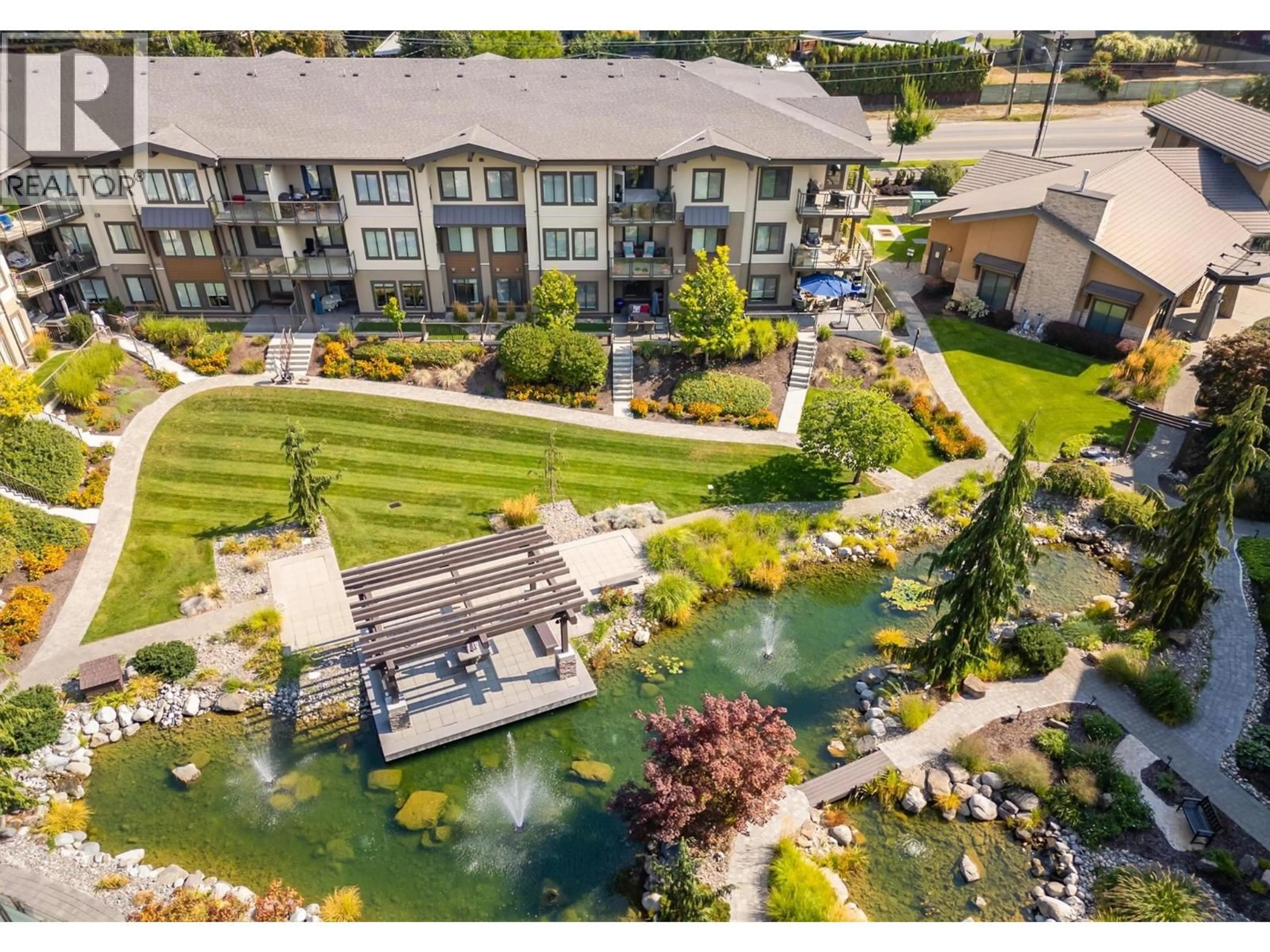A pic from outside/outdoor area/front of a property/back of a property/a pic from drone, water/lake/river/ocean view for 122 - 4380 LAKESHORE ROAD, Kelowna British Columbia V1W5N3
