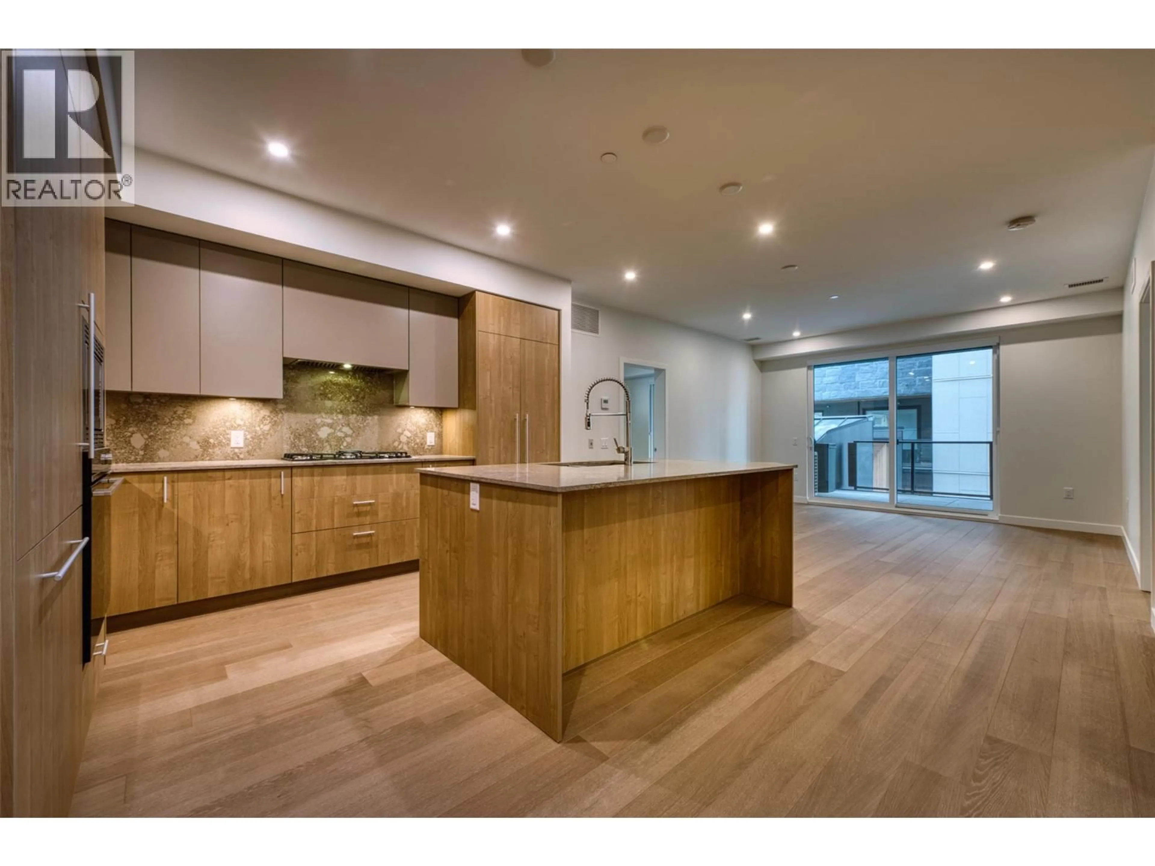 Open concept kitchen, wood/laminate floor for 201 - 9654 BENCHLAND DRIVE, Lake Country British Columbia V4V0C5