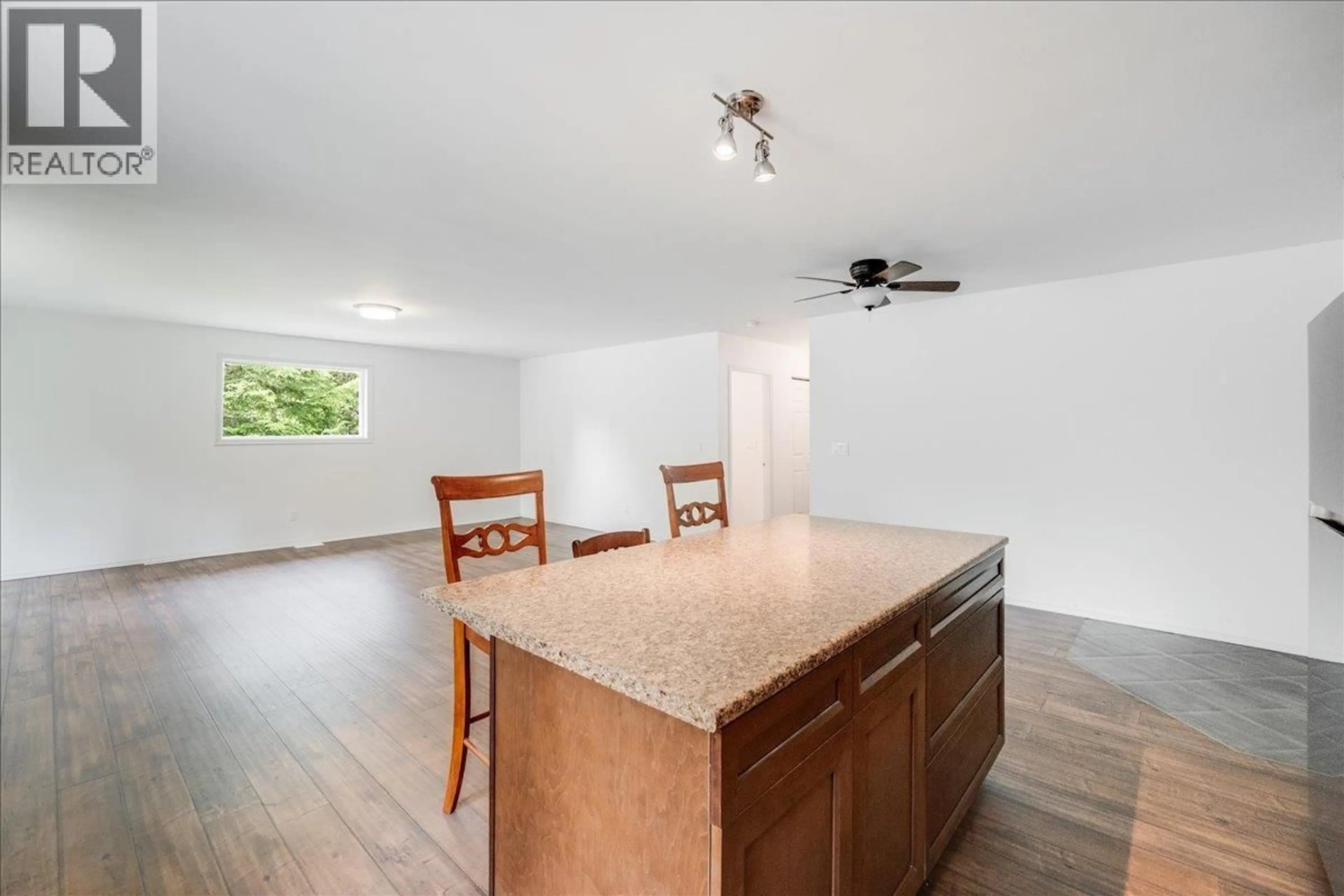 Open concept kitchen, wood/laminate floor for 116 LINESS ROAD, Salmo British Columbia V0G1Z0
